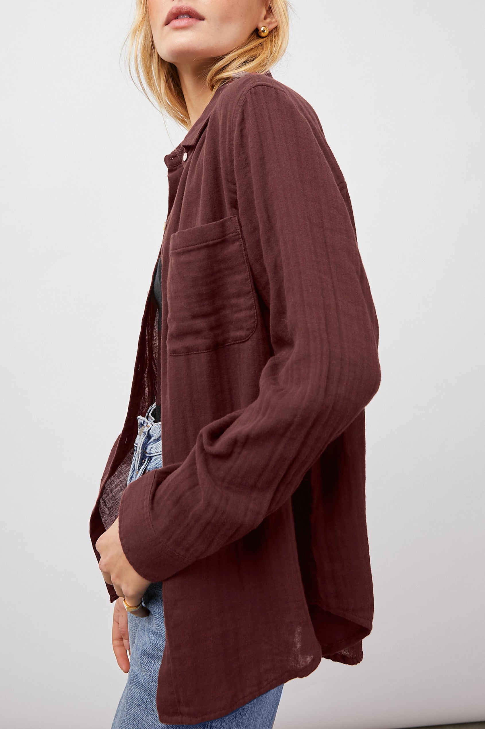 Ellis Long-Sleeve Button Down with Cuffs and a Patch Chest Pocket in Russet  Colorway - Side Unbuttoned View Featured on Model