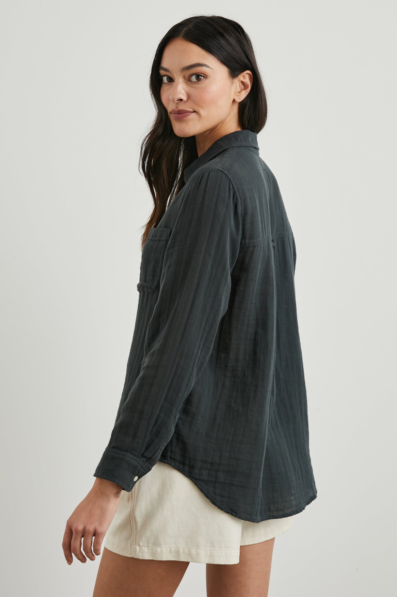 Ellis Long-Sleeve Button Down with Cuffs and a Patch Chest Pocket in Washed Black Colorway - Side View Featured on Model