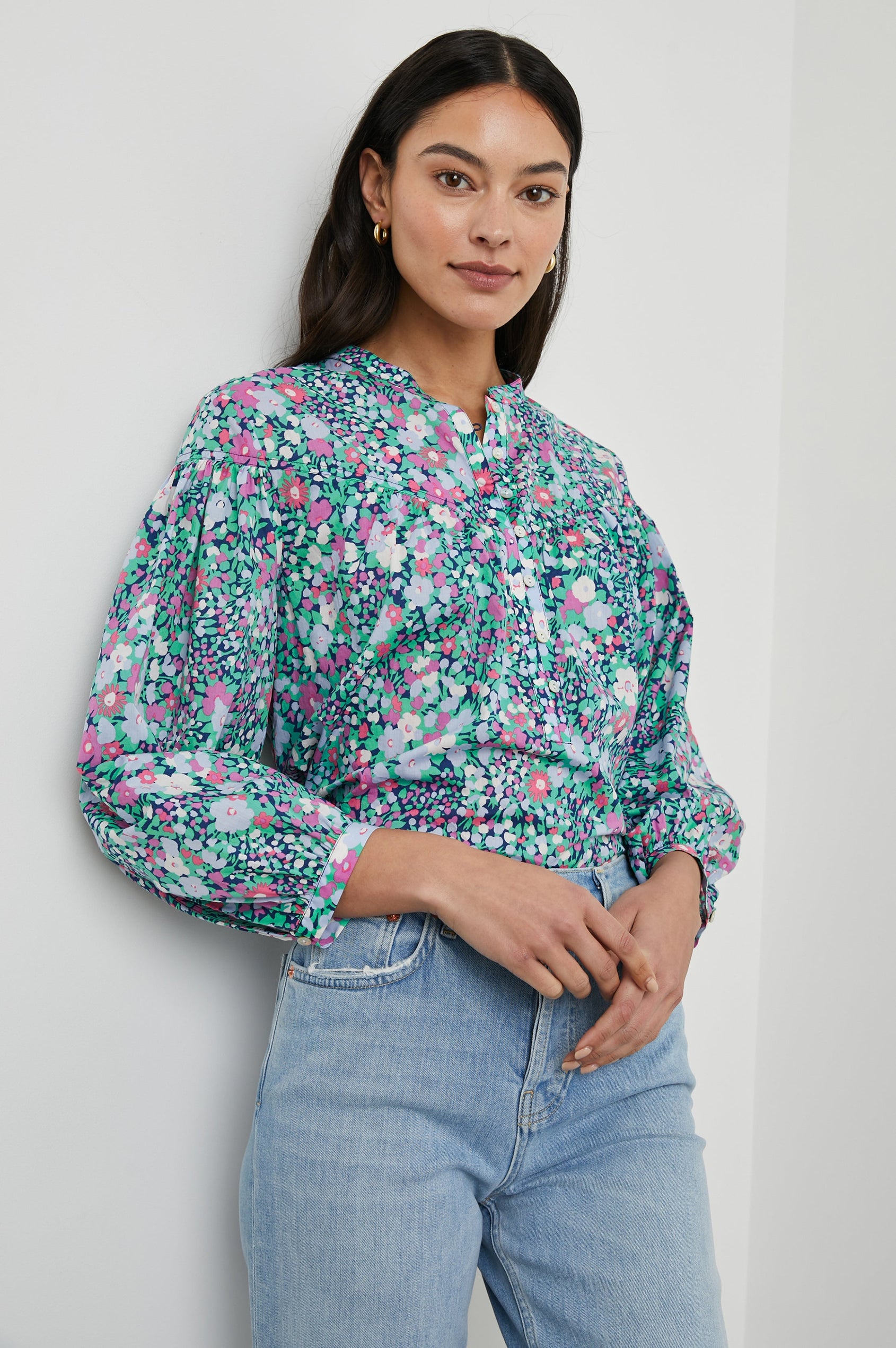 Ellison Top with Three-Quarter Sleeves, a Seven-Button Placket, and Button Cuffs in Navy Leilani Floral Colorway, Purples, Pinks and Greens on Navy - Front View Featured on Model 