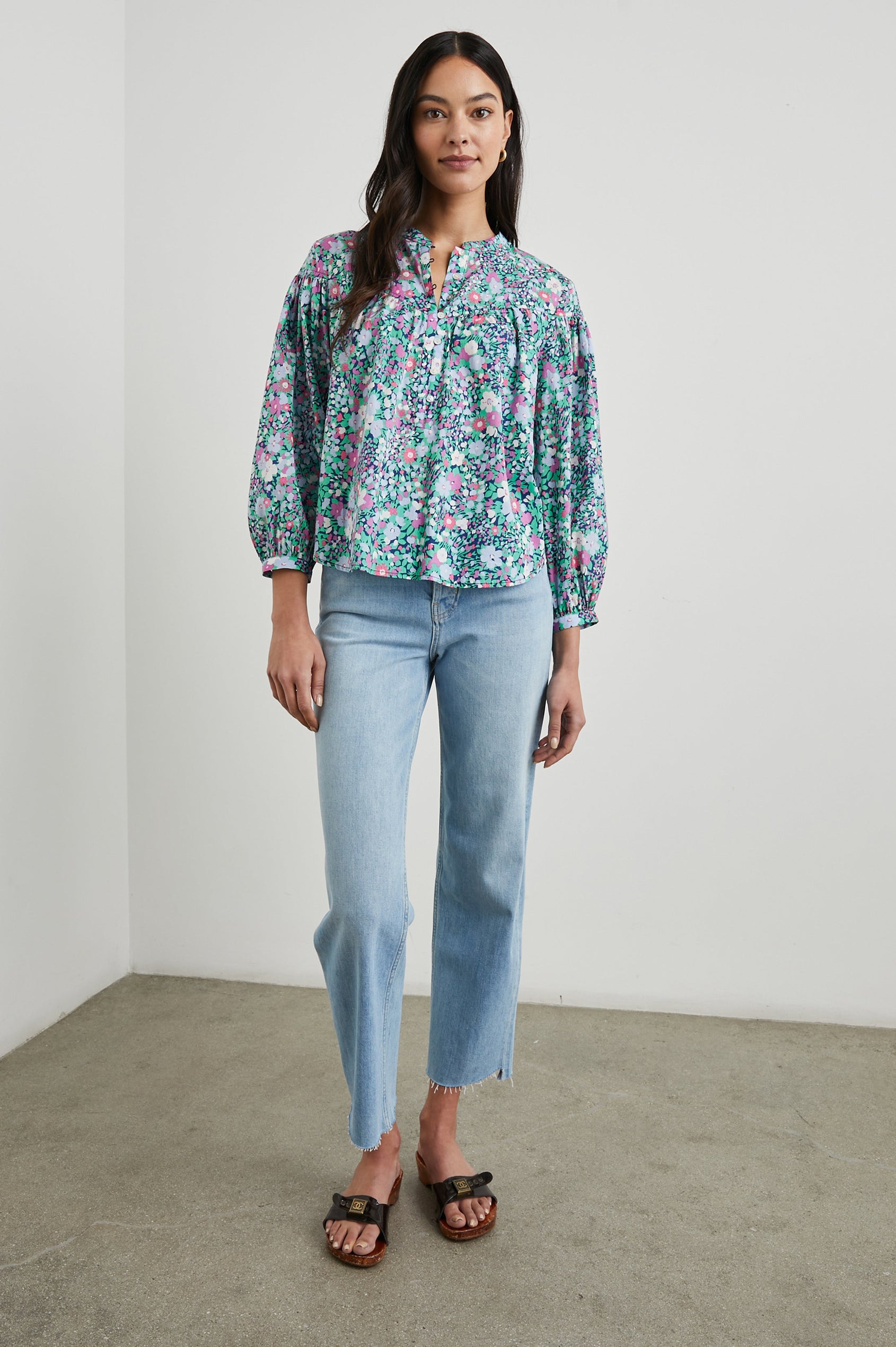 Ellison Top with Three-Quarter Sleeves, a Seven-Button Placket, and Button Cuffs in Navy Leilani Floral Colorway, Purples, Pinks and Greens on Navy - Front Full Body View Featured on Model 