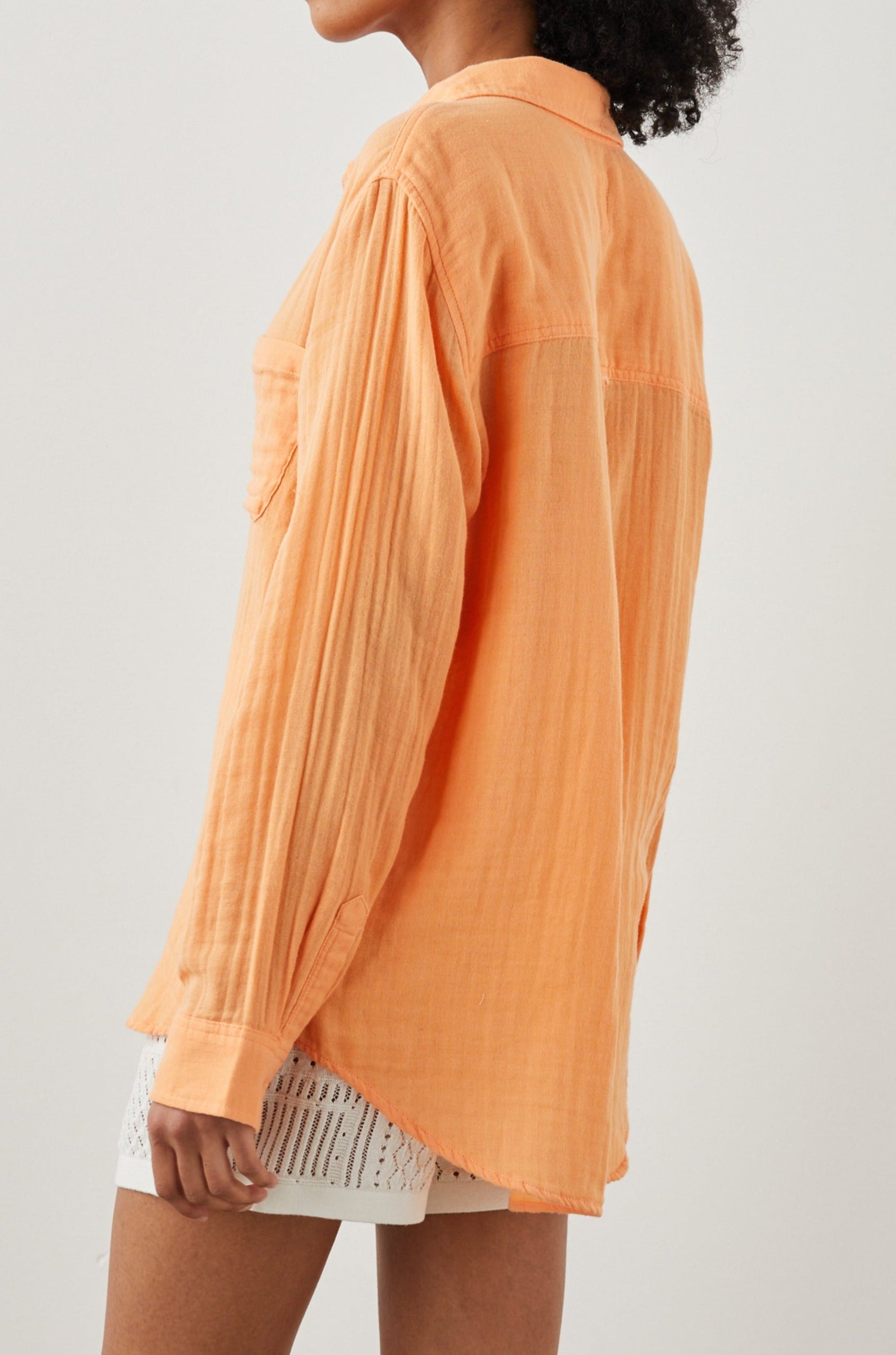 Ellis Long-Sleeve Button Down with Cuffs and a Patch Chest Pocket in Papaya Colorway - Back View Featured on Model