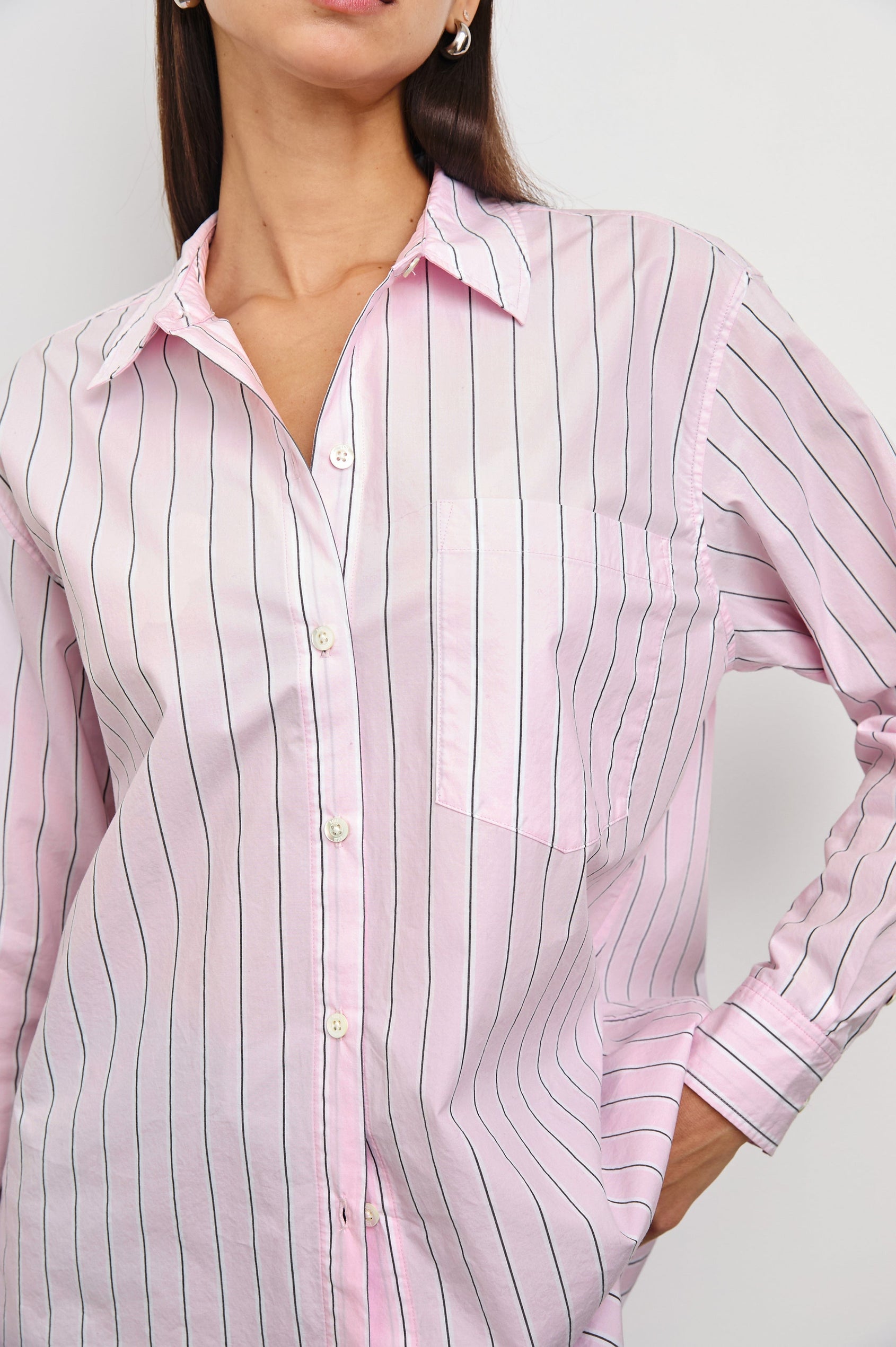 Elsa Long-Sleeve Button Down Shirt with Chest Patch Pocket in Cherry Blossom Stripe Colorway, Thin Black and White Vertical Stripes on Pink - Front Untucked View Featured on Model