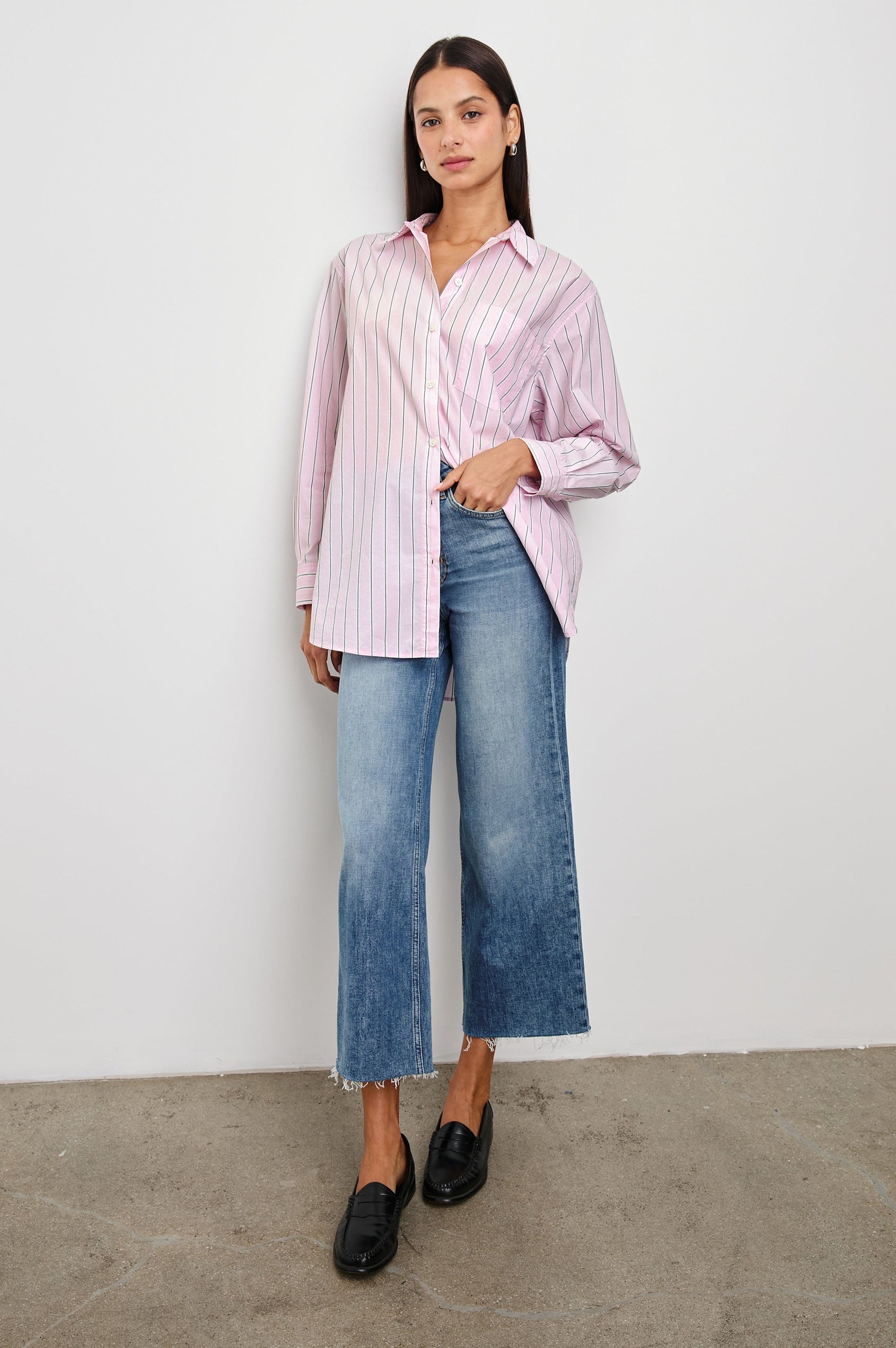 Elsa Long-Sleeve Button Down Shirt with Chest Patch Pocket in Cherry Blossom Stripe Colorway, Thin Black and White Vertical Stripes on Pink - Front Untucked Full Body View Featured on Model