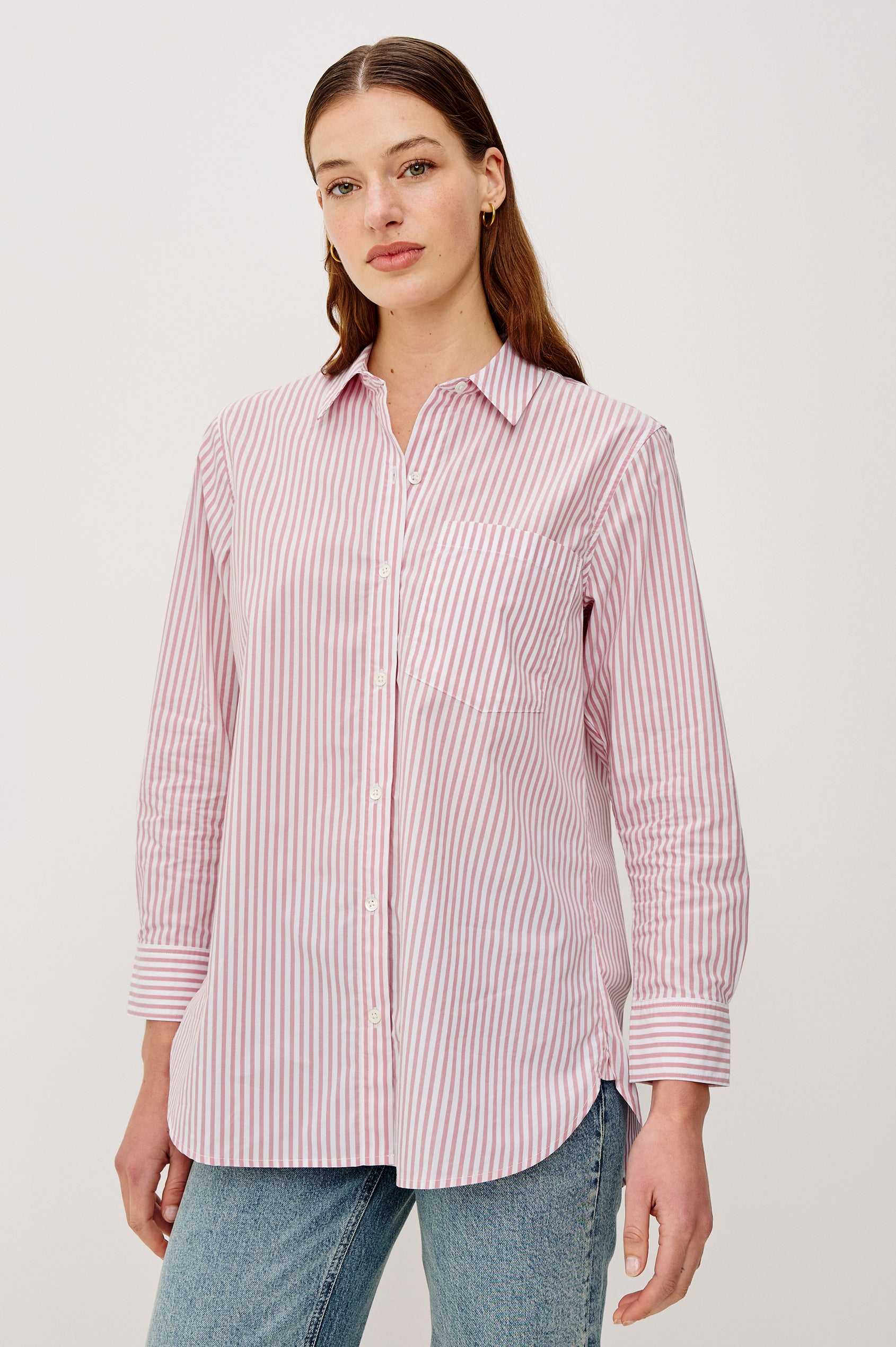 Elsa Button-Up Shirt in Cotton Poplin With Relaxed Oversized Fit Classic Chest Pocket Long Sleeves and Curved Hem in Rose Stripe Colorway - Upper Body Front View Featured on Model