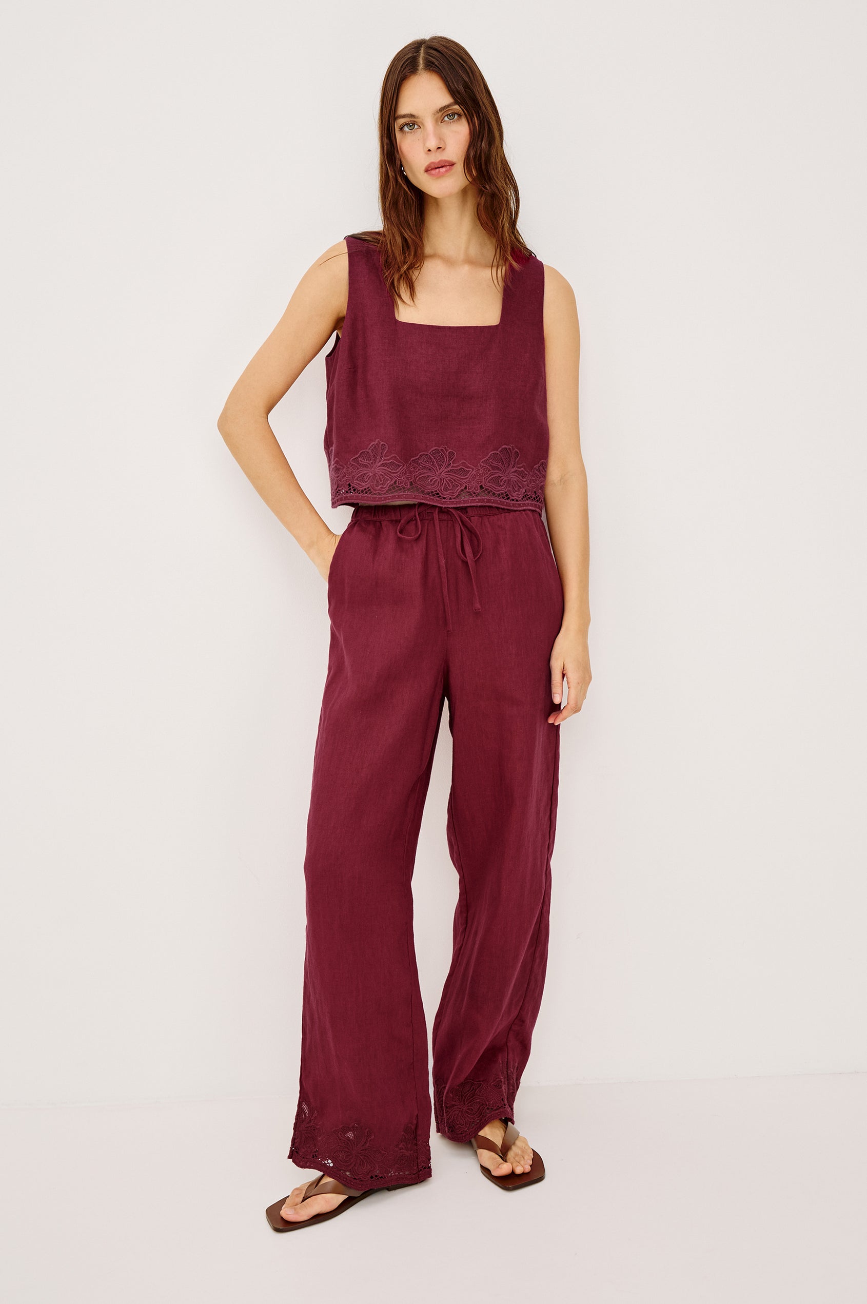 Emmie Straight Leg Pant in Linen With Adjustable Drawstring Waist Ties in Hibiscus Embroidery Colorway — Full Body Front View Featured on Model