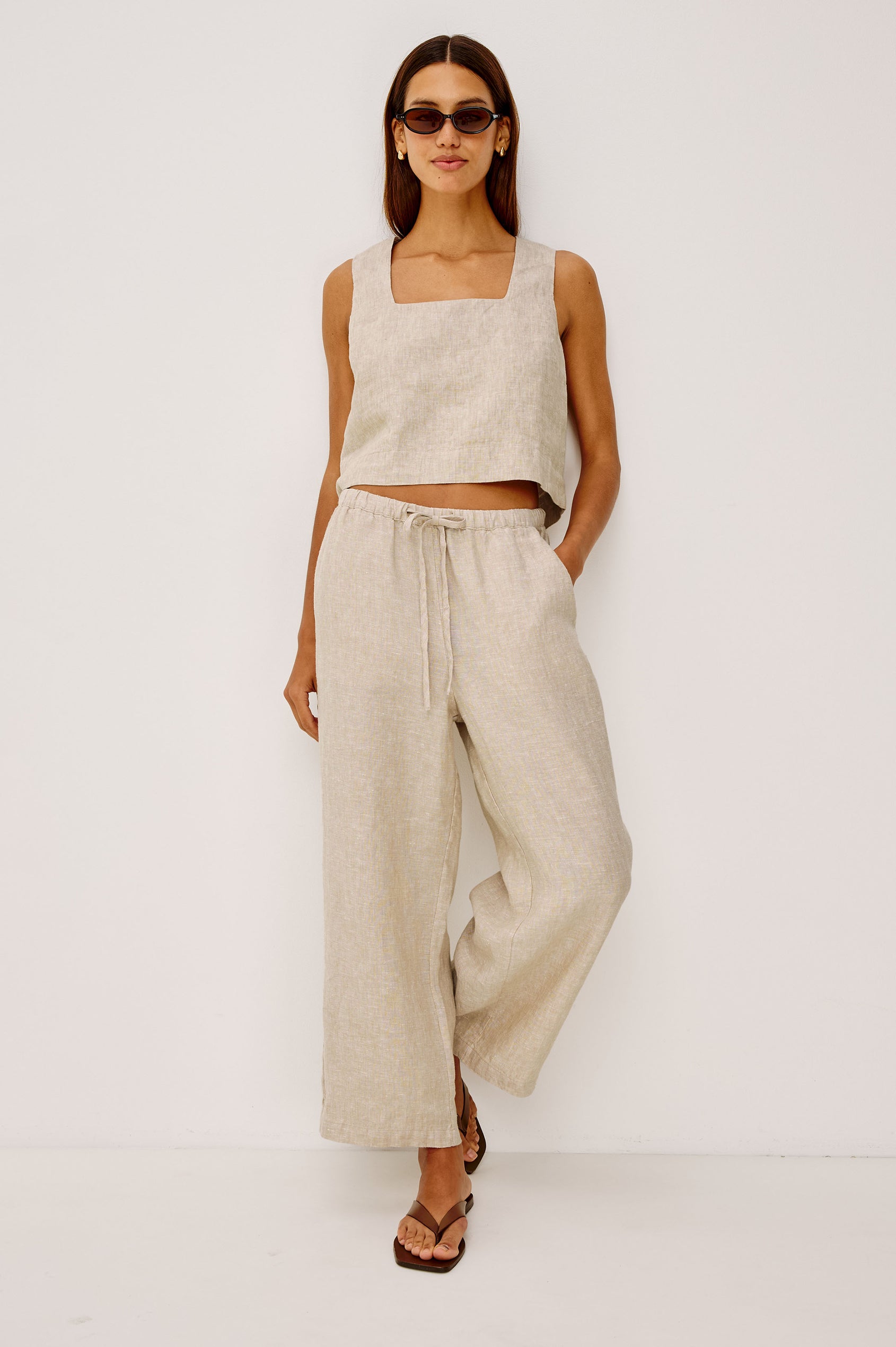 Emmie Crop Pant in Linen With Straight Legs, Adjustable Drawstring Waist Ties, and Side Pockets in Heathered Flax Colorway - Full Body Front View Featured on Model