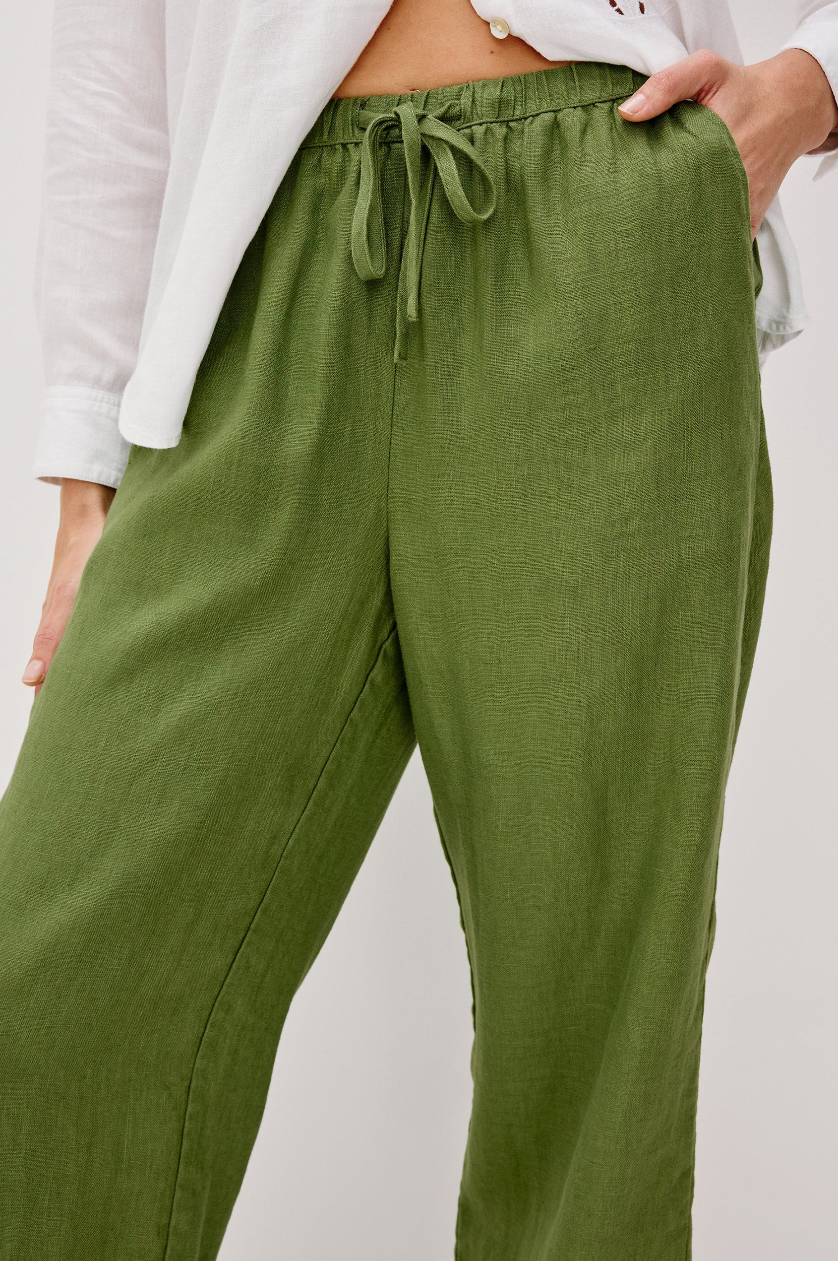 Emmie high rise linen wide leg pant with drawstring in Dill colorway- front detail view on model.