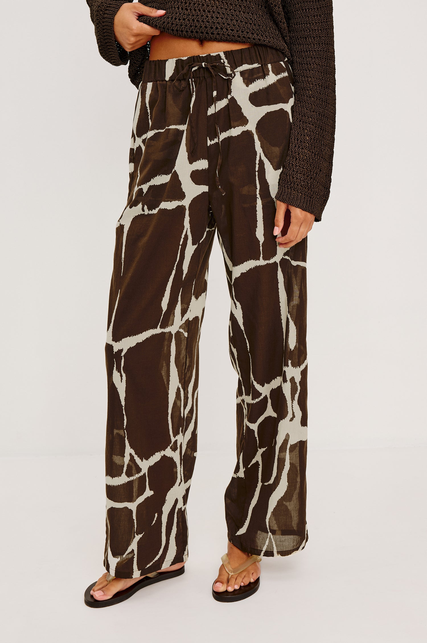 Emmie High-Waisted Wide-Leg Pant in Unlined Beach Cotton With Relaxed Fit Side Pockets and Adjustable Drawstring Waist Ties in Terra Colorway - Lower Body Front View Featured on Model