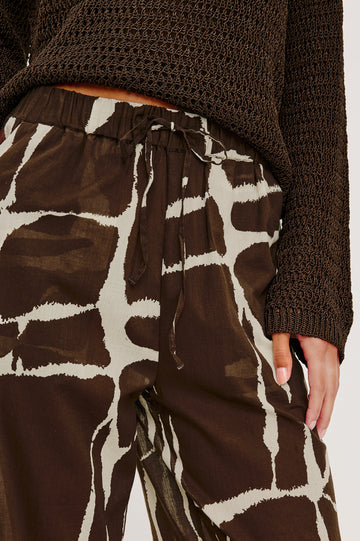 Emmie High-Waisted Wide-Leg Pant in Unlined Beach Cotton With Relaxed Fit Side Pockets and Adjustable Drawstring Waist Ties in Terra Colorway - Lower Body Close Up Front View Featured on Model