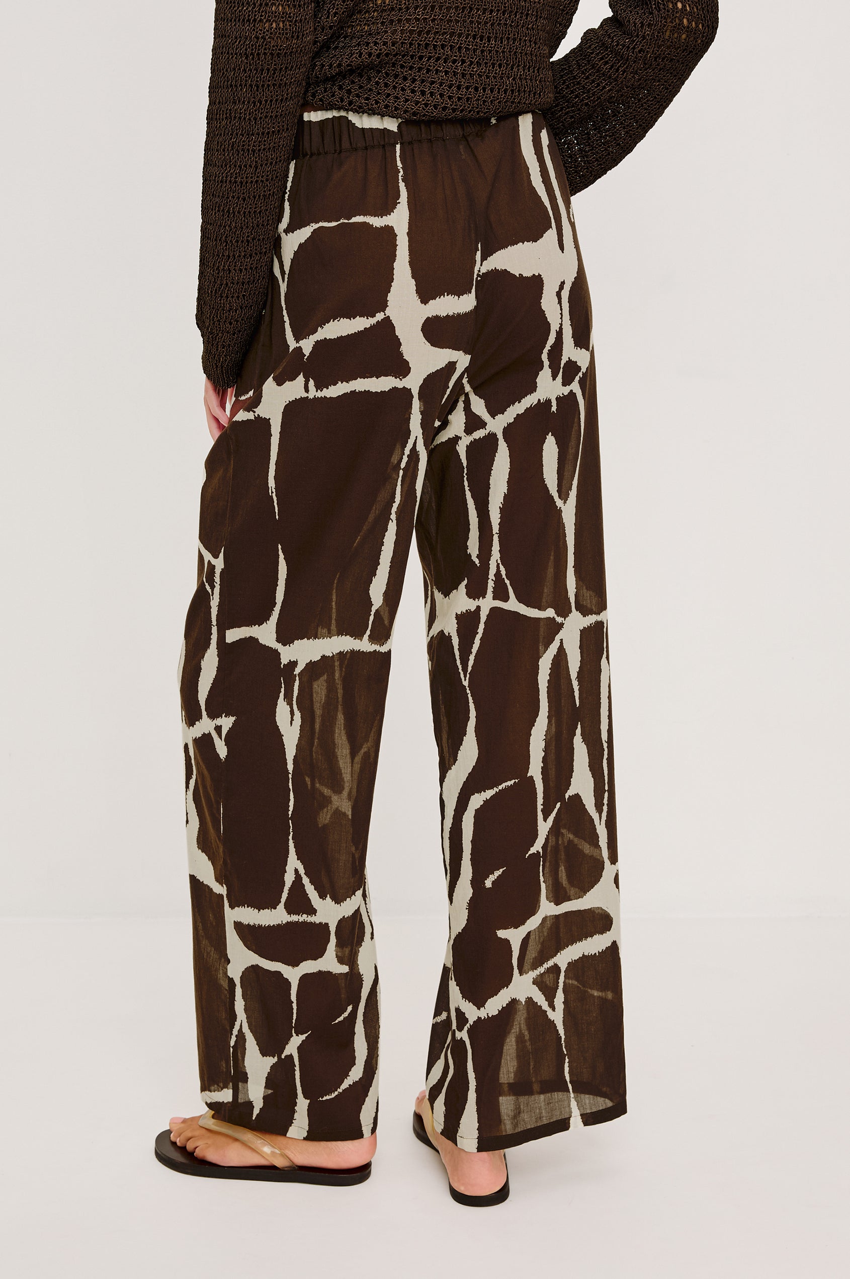 Emmie High-Waisted Wide-Leg Pant in Unlined Beach Cotton With Relaxed Fit Side Pockets and Adjustable Drawstring Waist Ties in Terra Colorway - Lower Body Back View Featured on Model