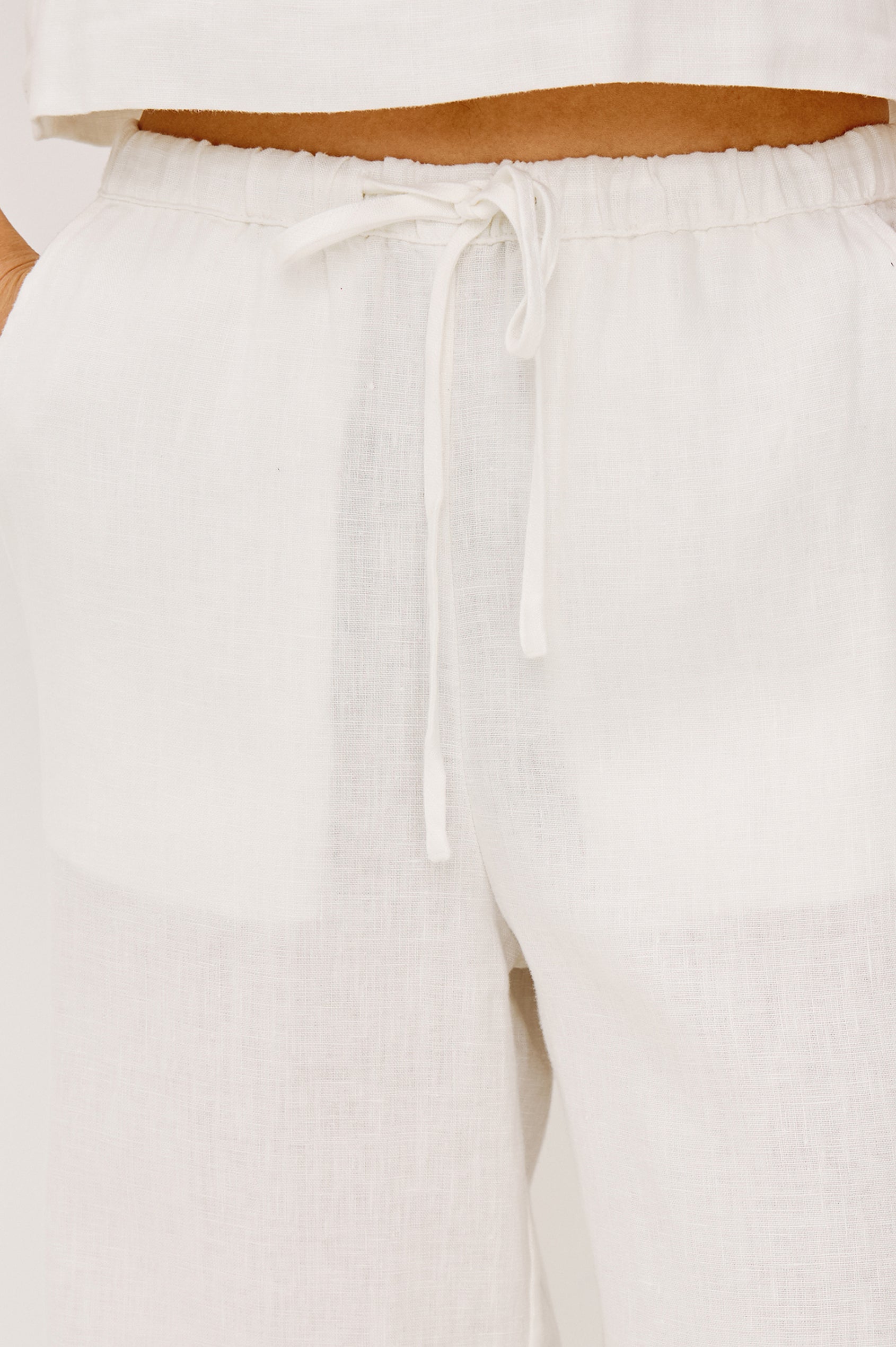 Emmie high rise linen wide leg pant with drawstring in white - front view on model