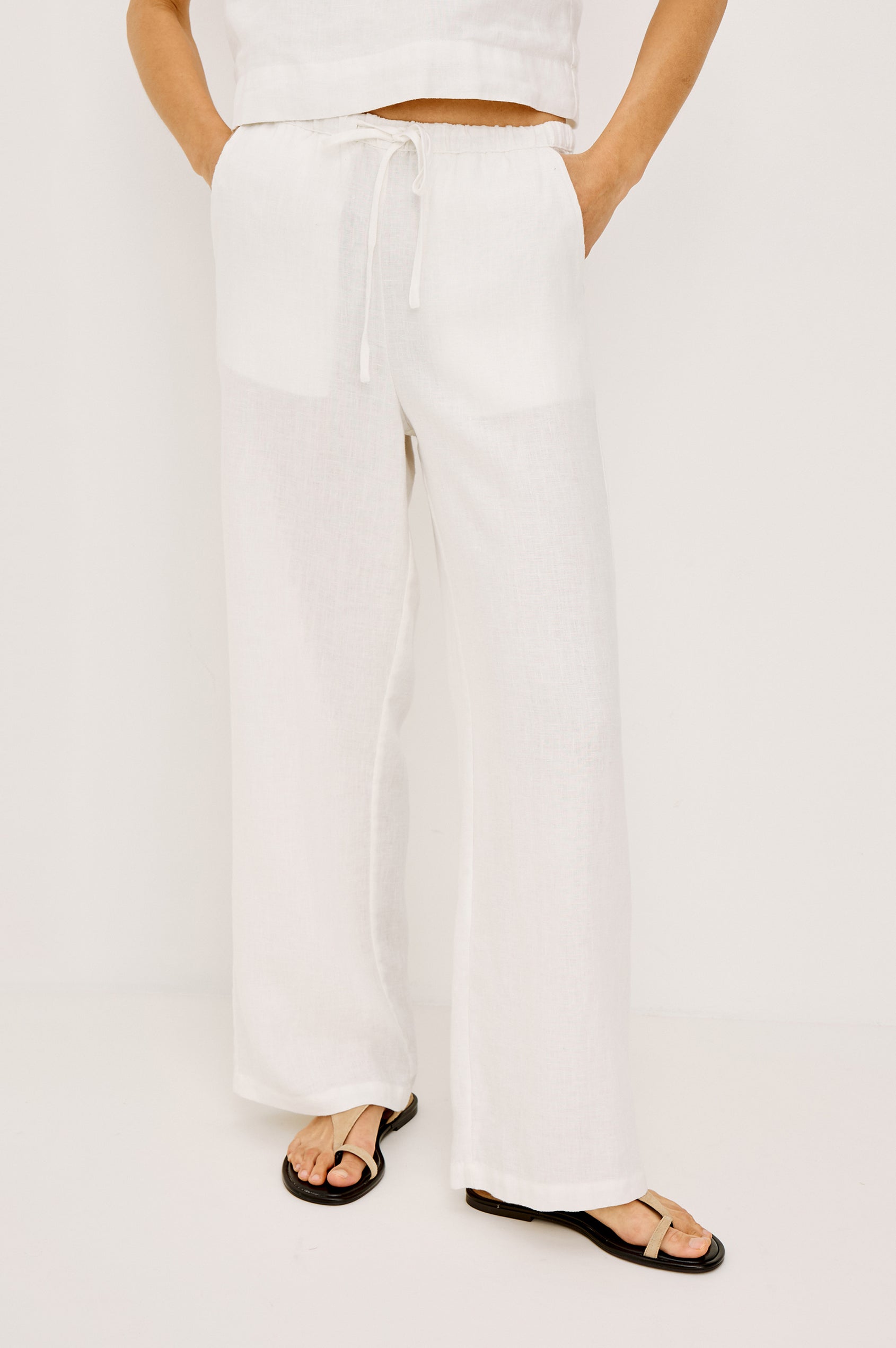 Emmie high rise linen wide leg pant with drawstring in white - front view on model