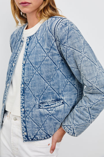 Ency Jacket with Quilted Denim, Snap Closure and Two Front Patch Pockets in Mid Blue Colorway - Side View Featured on Model