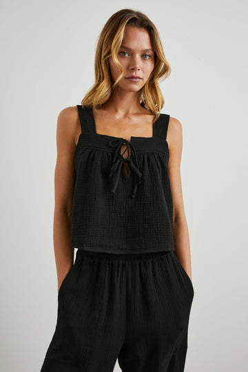 Enya Cropped Tank Top with a Square Neck with a V Cutout with Ties in Black Gauze Colorway - Front View Featured on Model