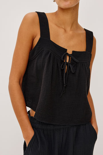 Enya Cropped Tank Top with a Square Neck with a V Cutout with Ties in Black Gauze Colorway - Front View Featured on Model