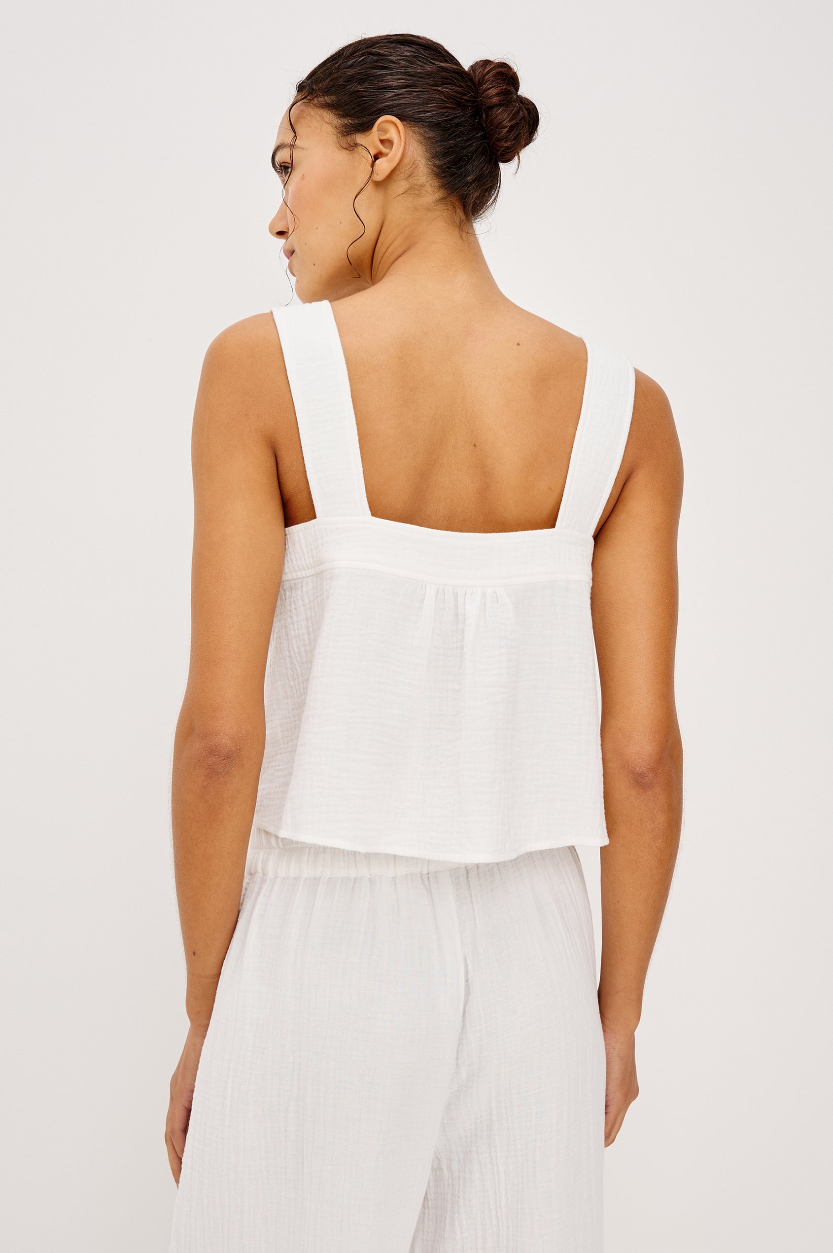 Enya Cropped Tank Top in Cotton Gauze With Square Neckline, Wide Shoulder Straps, Center Bust Keyhole With Adjustable Ties, and Relaxed Fit in White Colorway - Upper Body Back View Featured on Model