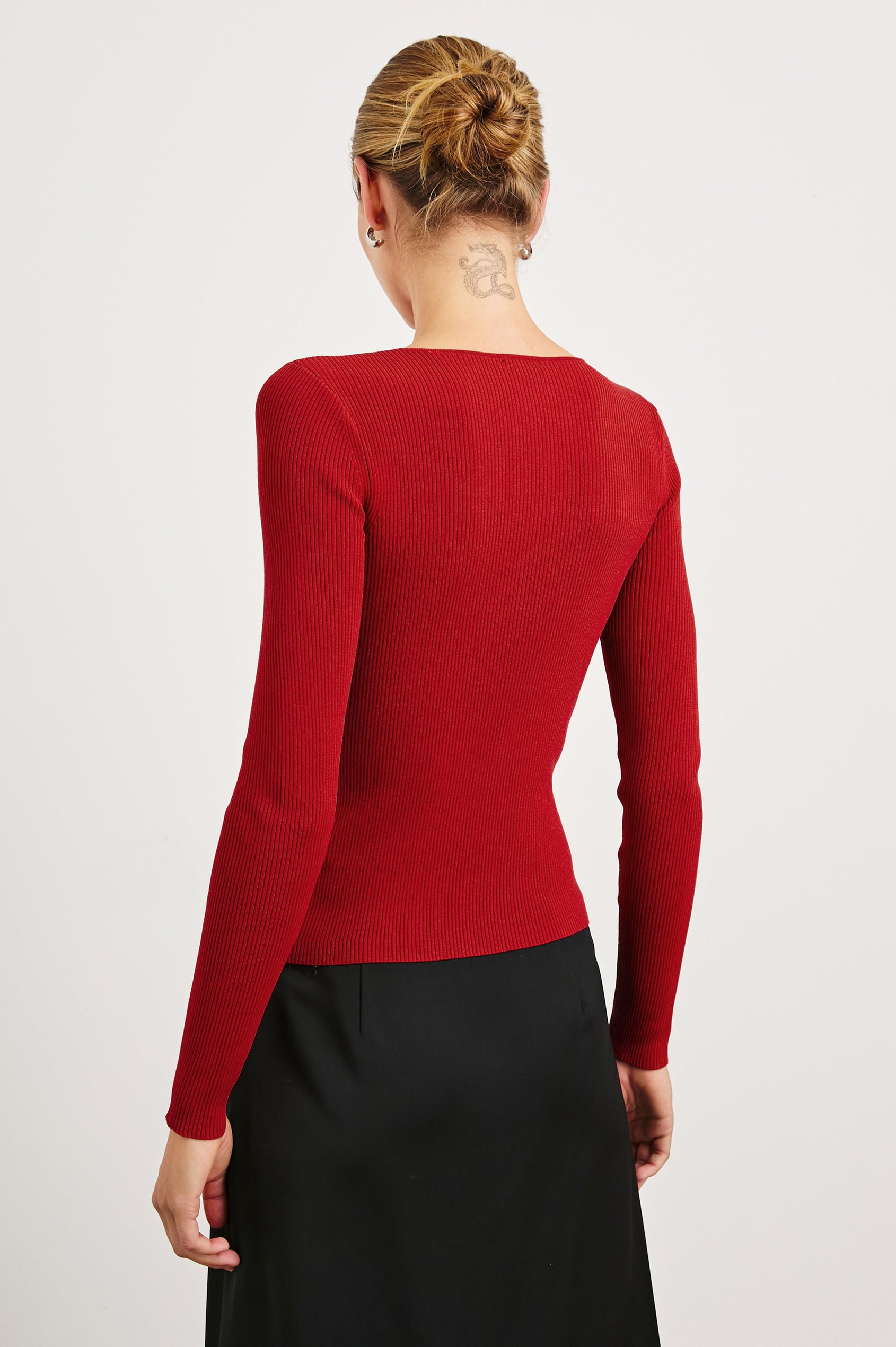 Erina Long-Sleeve Ribbed Top with a Boat Neck, Twisted Fabric and a Cutout at the Neck in Cherry Colorway - Back View Featured on Model 
