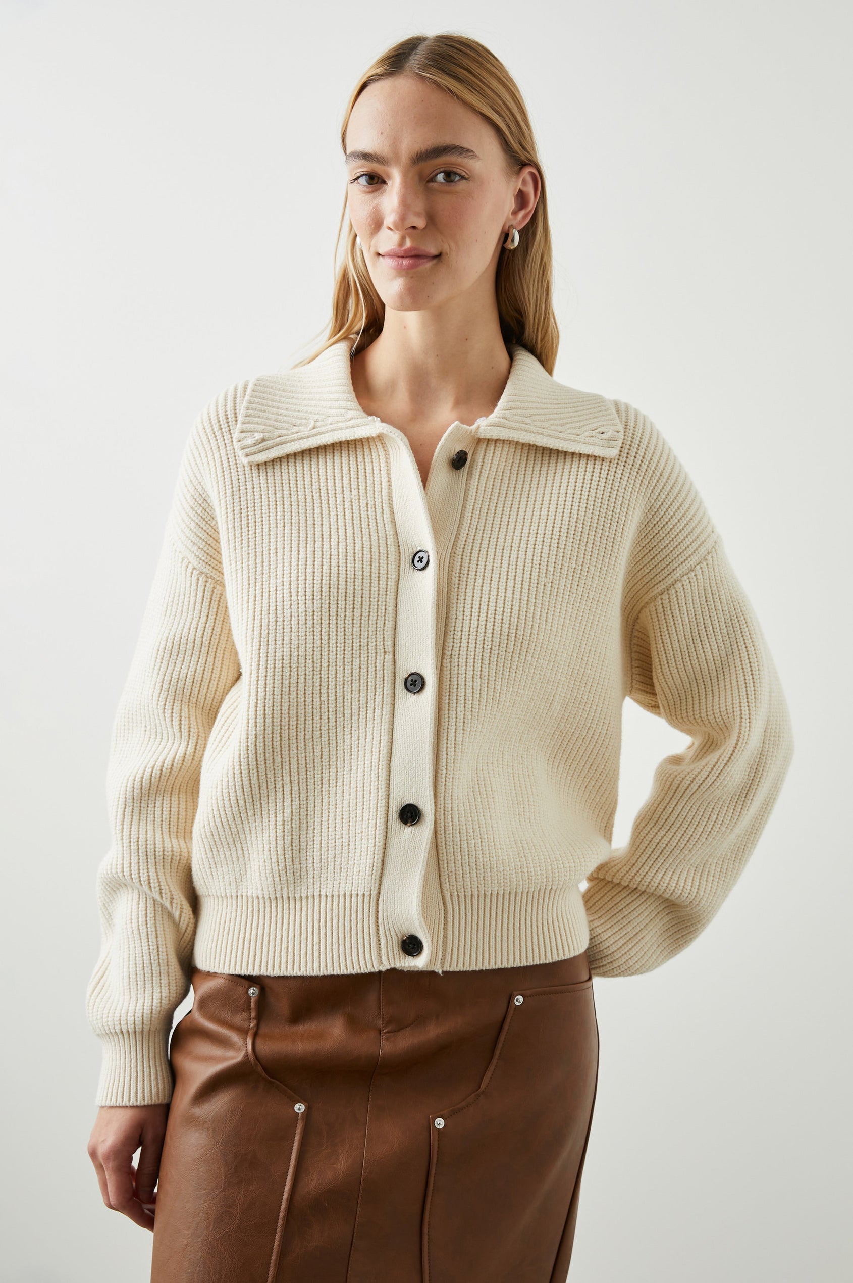 Esme Long-Sleeve Ribbed Sweater with Front Button Closure and a Faux Fur Collar in Ivory Colorway - Front View Featured on Model 