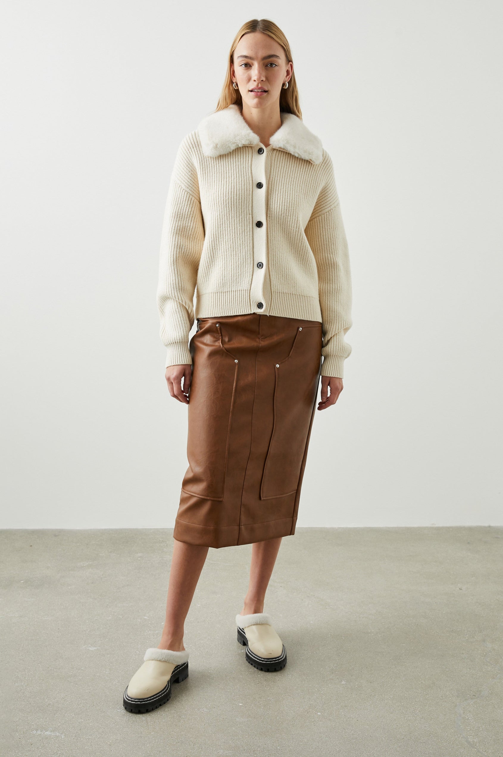 Esme Long-Sleeve Ribbed Sweater with Front Button Closure and a Faux Fur Collar in Ivory Colorway - Front Full Body View Featured on Model 