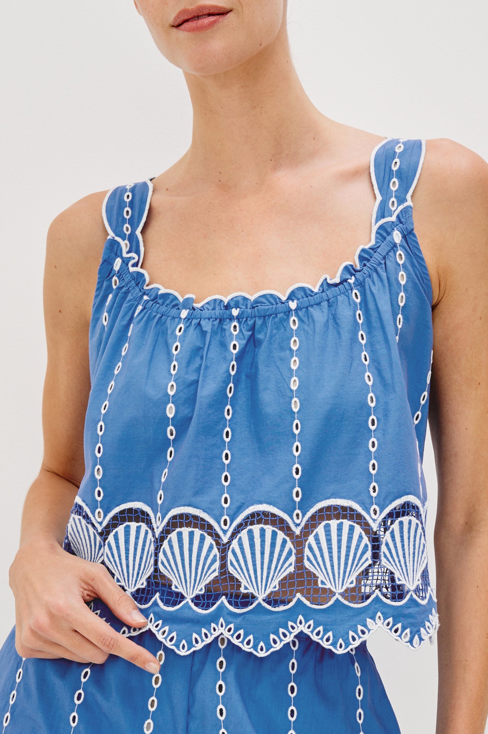 Esperanza Scoop Neck Tank Top with Sea Shell Embroidery and Scalloped Hems in French Blue Colorway. Front Detail View Shown on Model.