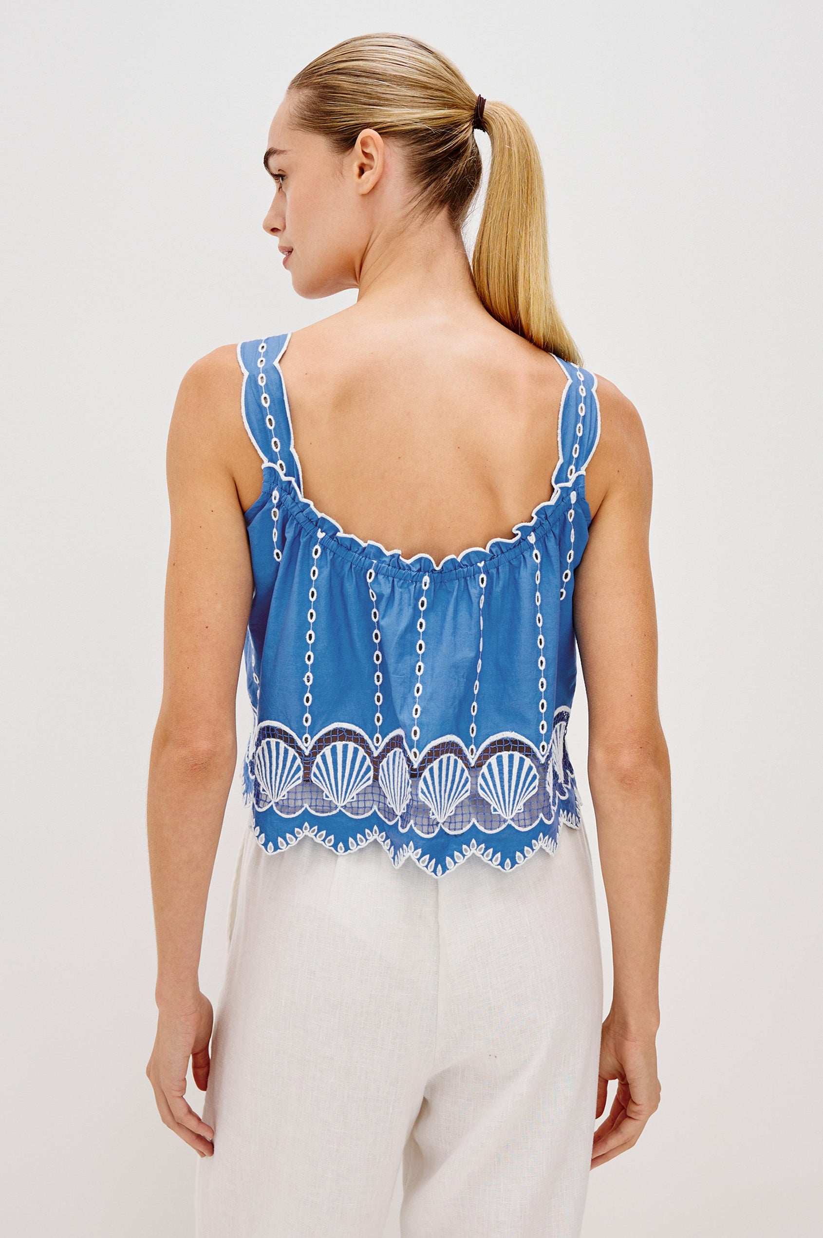 Esperanza Scoop Neck Tank Top with Sea Shell Embroidery and Scalloped Hems in French Blue Colorway. Back View Shown on Model.
