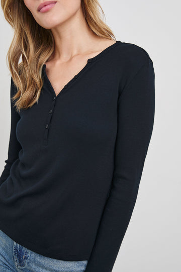 Essential Long-Sleeve Finely Ribbed Henley, with a V Neck and a Placket with Buttons in Black Colorway - Front View Featured on Model 