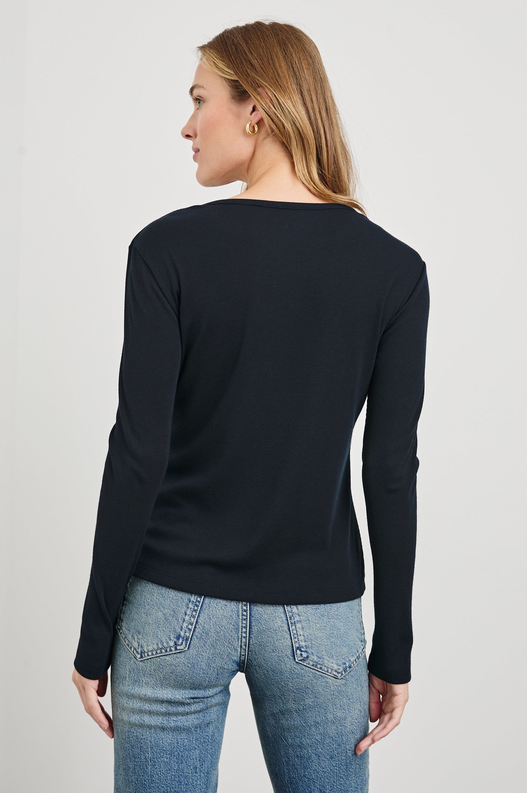 Essential Long-Sleeve Finely Ribbed Henley, with a V Neck and a Placket with Buttons in Black Colorway - Back View Featured on Model 