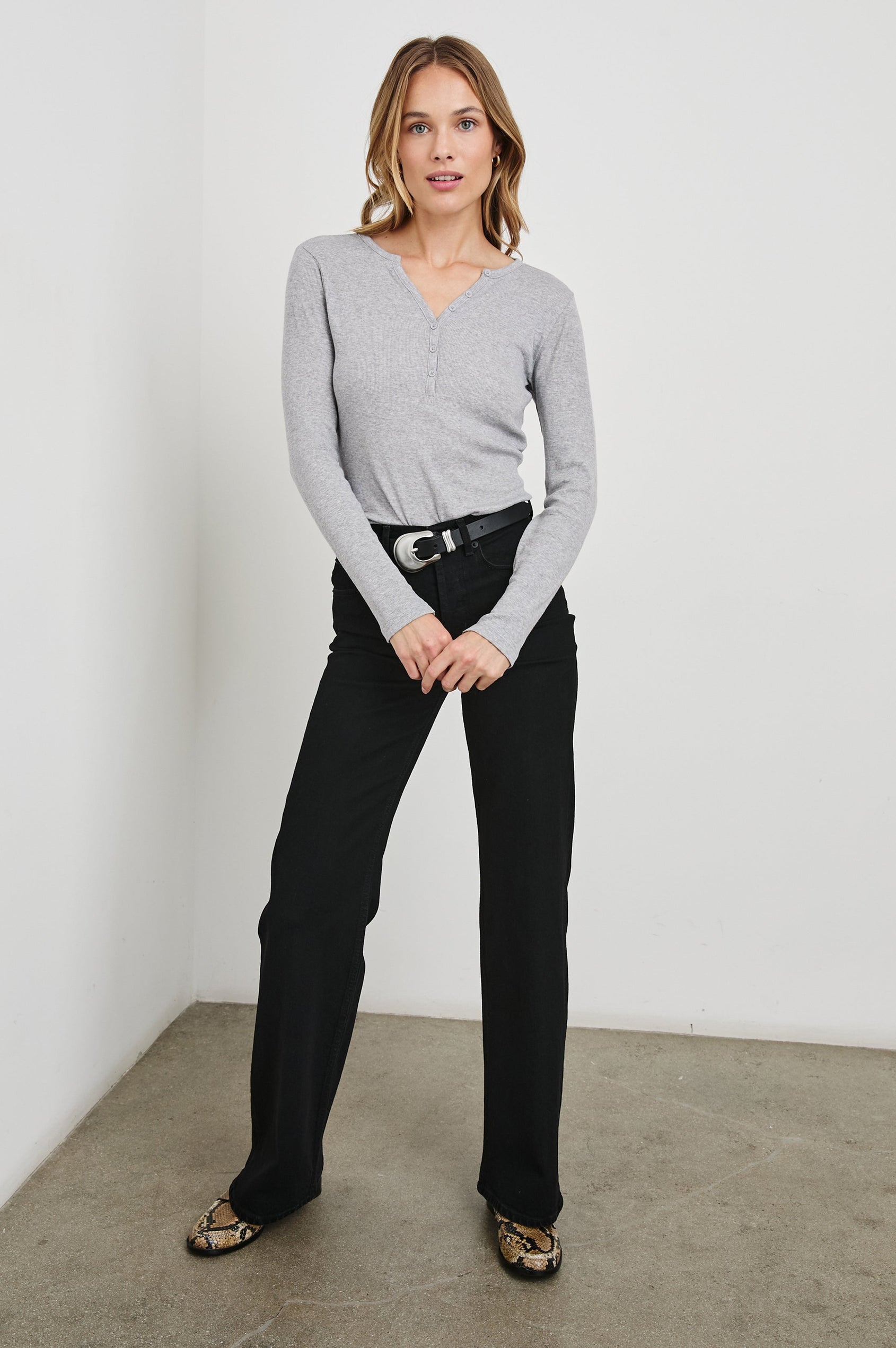 Essential Long-Sleeve Finely Ribbed Henley, with a V Neck and a Placket with Buttons in Heather Grey Colorway - Front Tucked Full Body View Featured on Model 