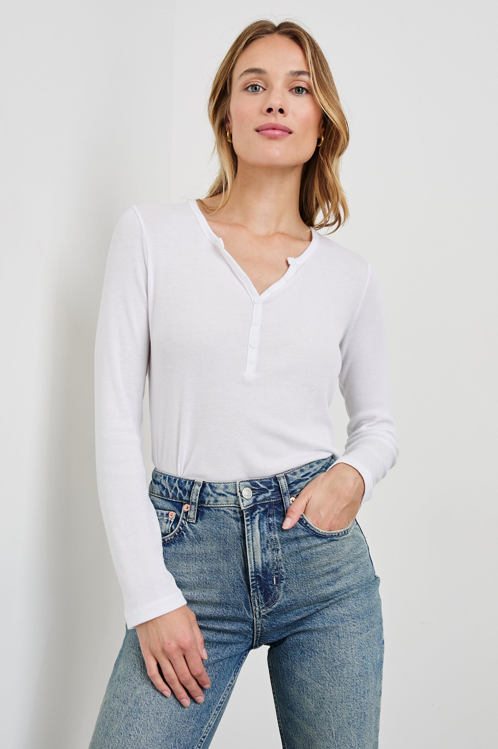 Essential Long-Sleeve Finely Ribbed Henley, with a V Neck and a Placket with Buttons in White Colorway - Front Tucked View Featured on Model 