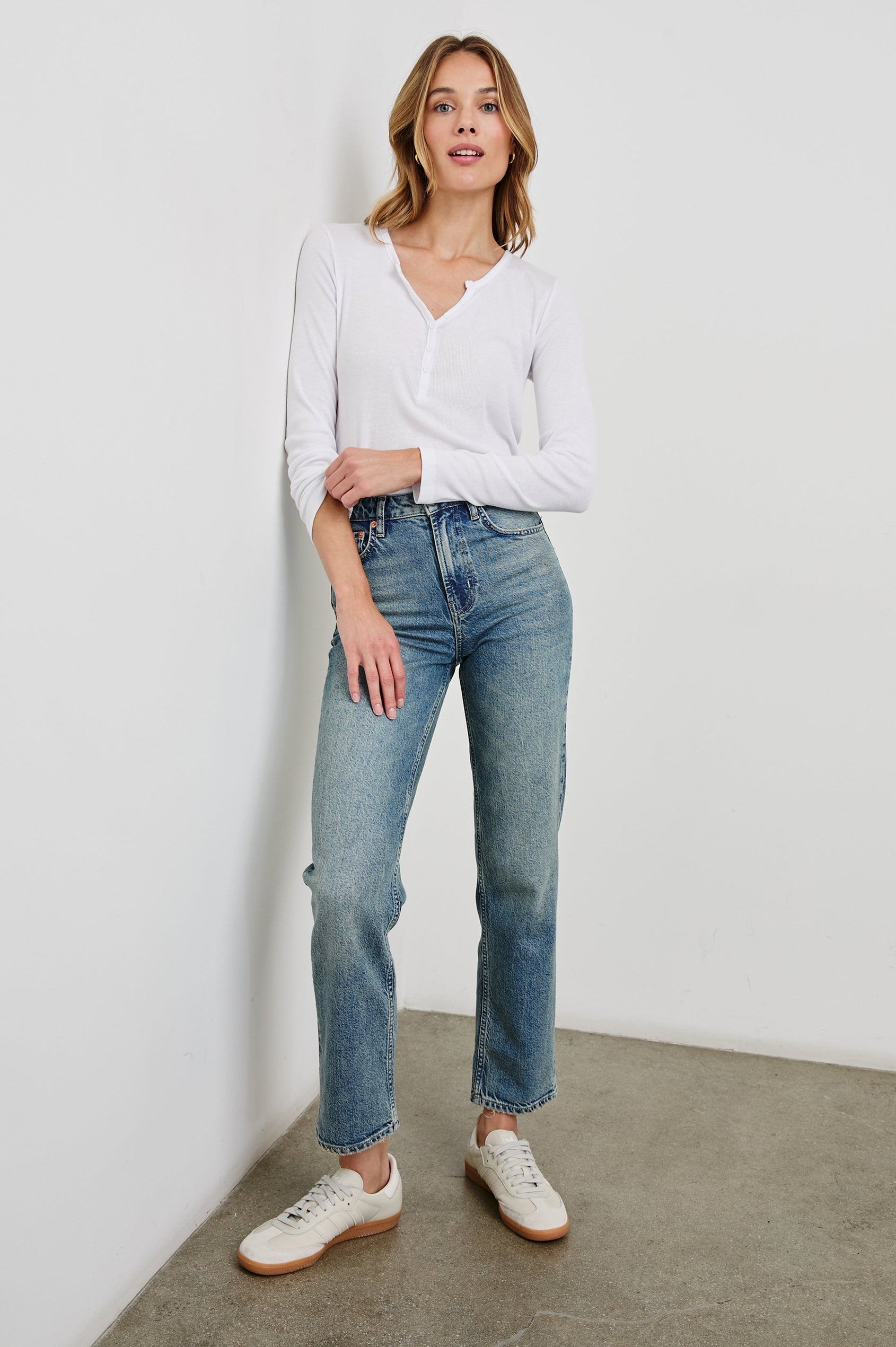 Essential Long-Sleeve Finely Ribbed Henley, with a V Neck and a Placket with Buttons in White Colorway - Front Tucked Full Body View Featured on Model 