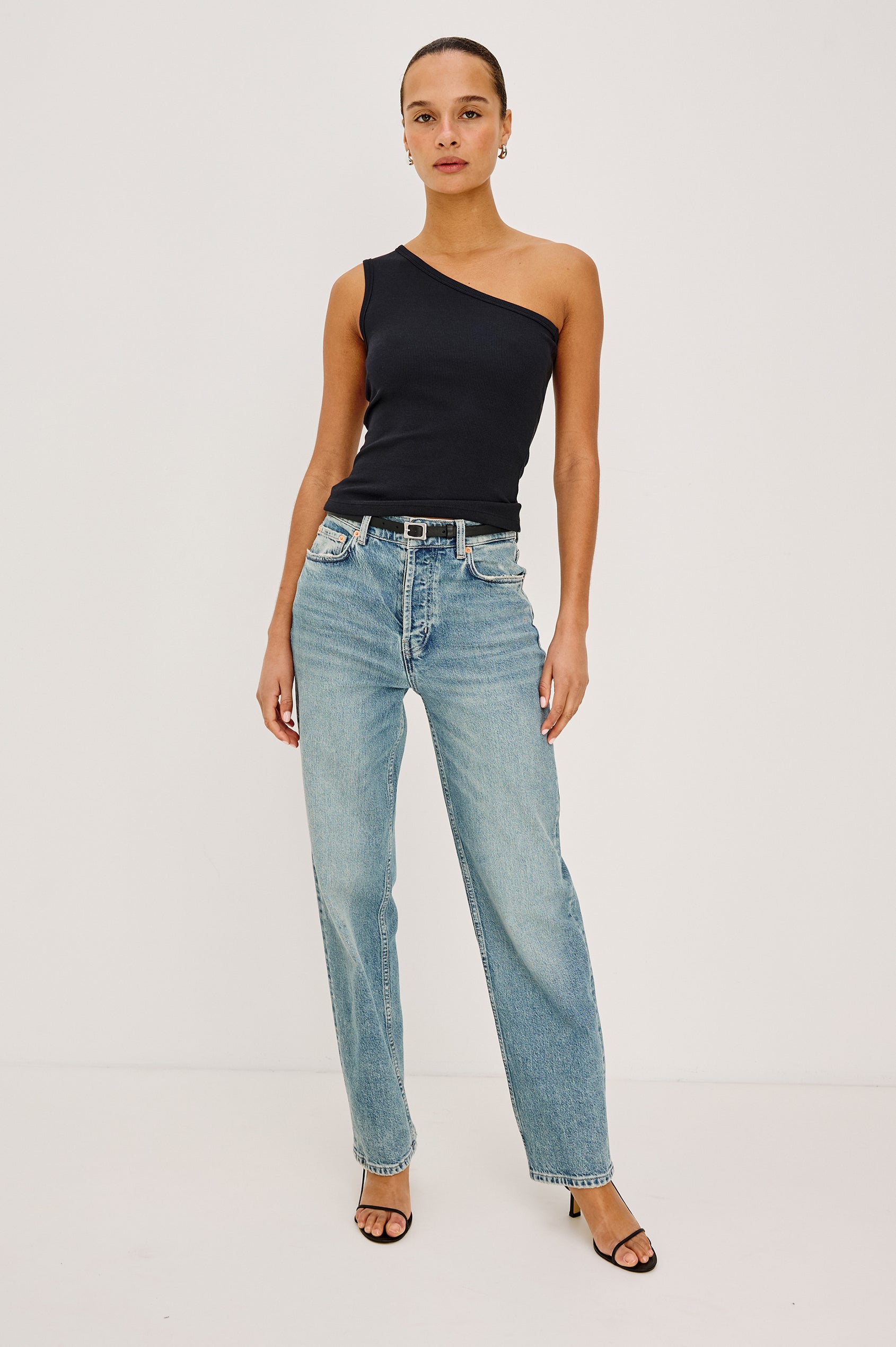 Esti Tank Top in Ribbed Cotton Blend With One-Shoulder Neckline in Black Colorway - Full Body Front View Featured on Model