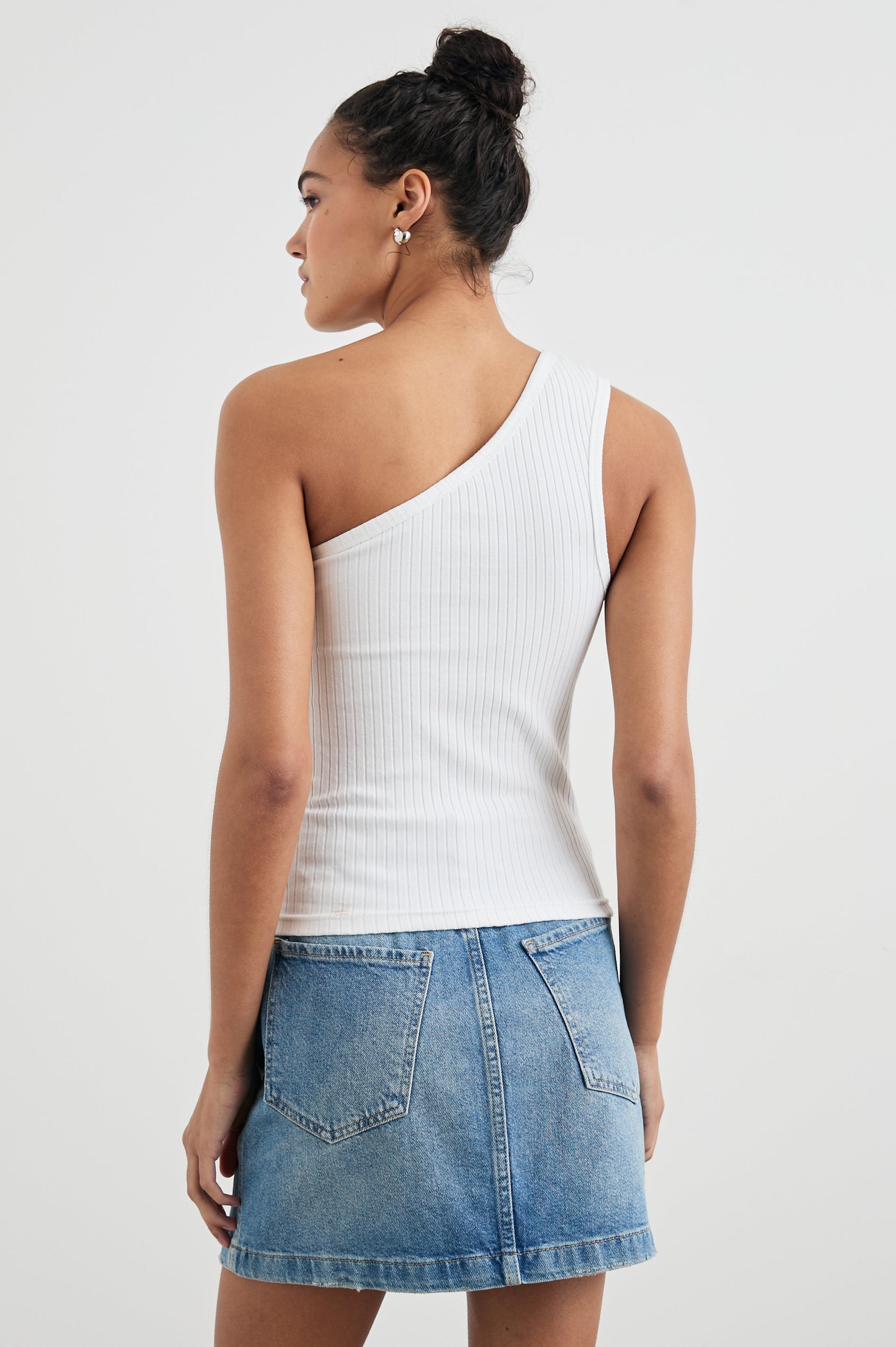 Esti Sleeveless Ribbed Top with an Asymmetrical Neckline with One Strap in White Colorway - Back View Featured on Model