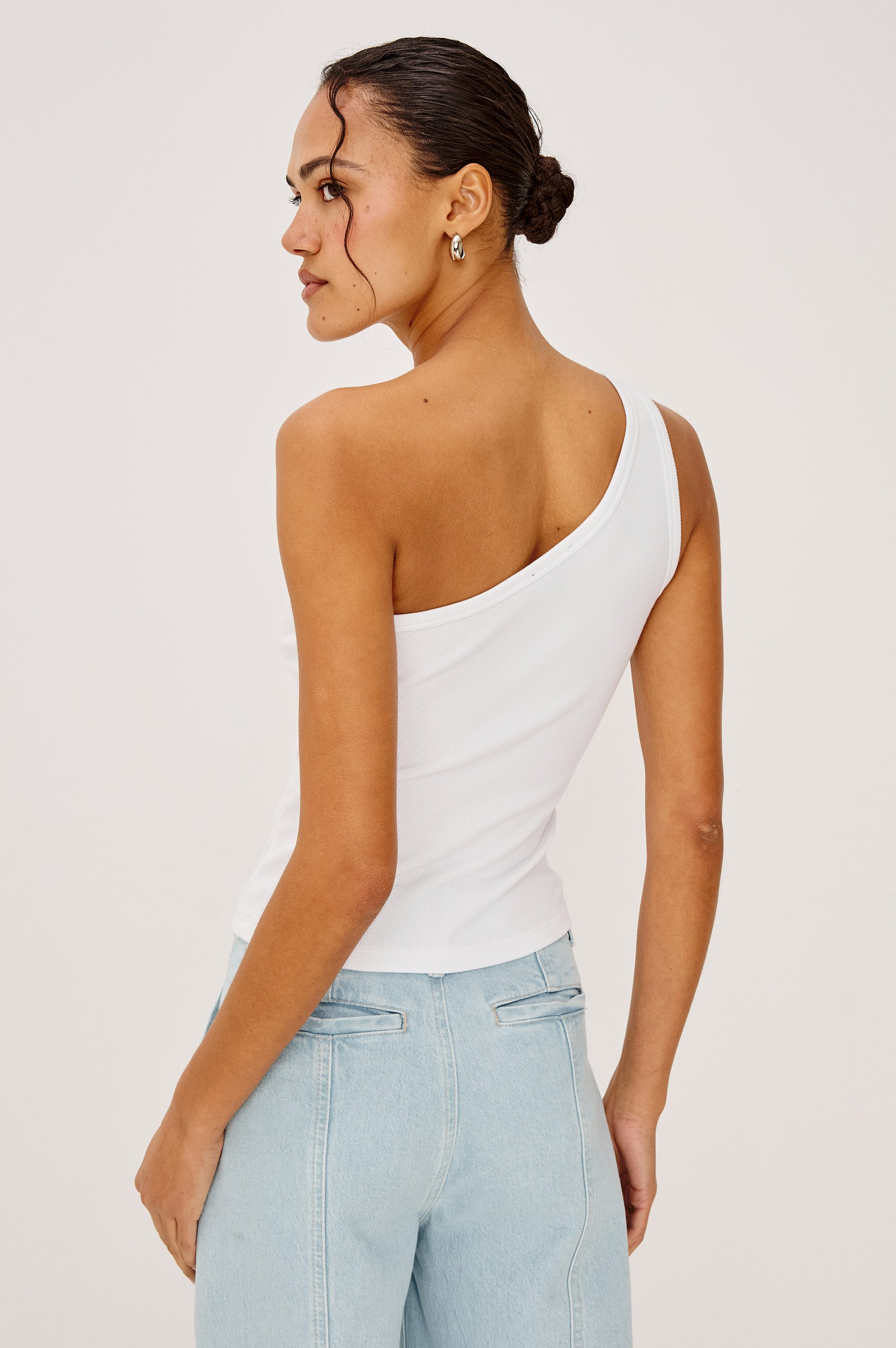 Esti Top in Ribbed Cotton Blend With One-Shoulder Neckline and Fitted Silhouette in White Rib Colorway - Upper Body Front View Featured on Model