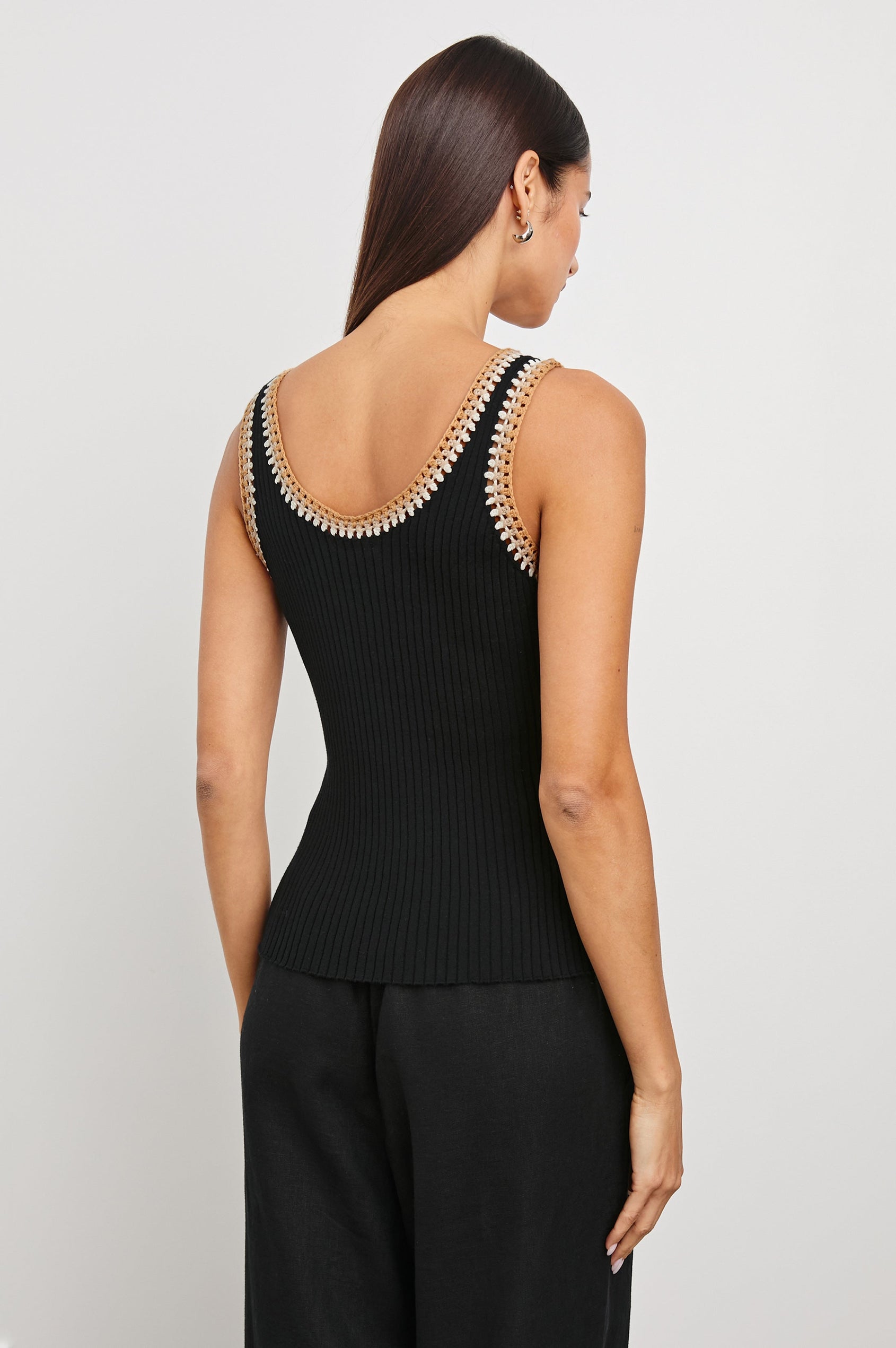 Estrella Ribbed Cami with a Scoop Neck and Crochet Trim Along the Straps and Neckline in Black Colorway with White, Beige, and Tan Trim - Back View Featured on Model
