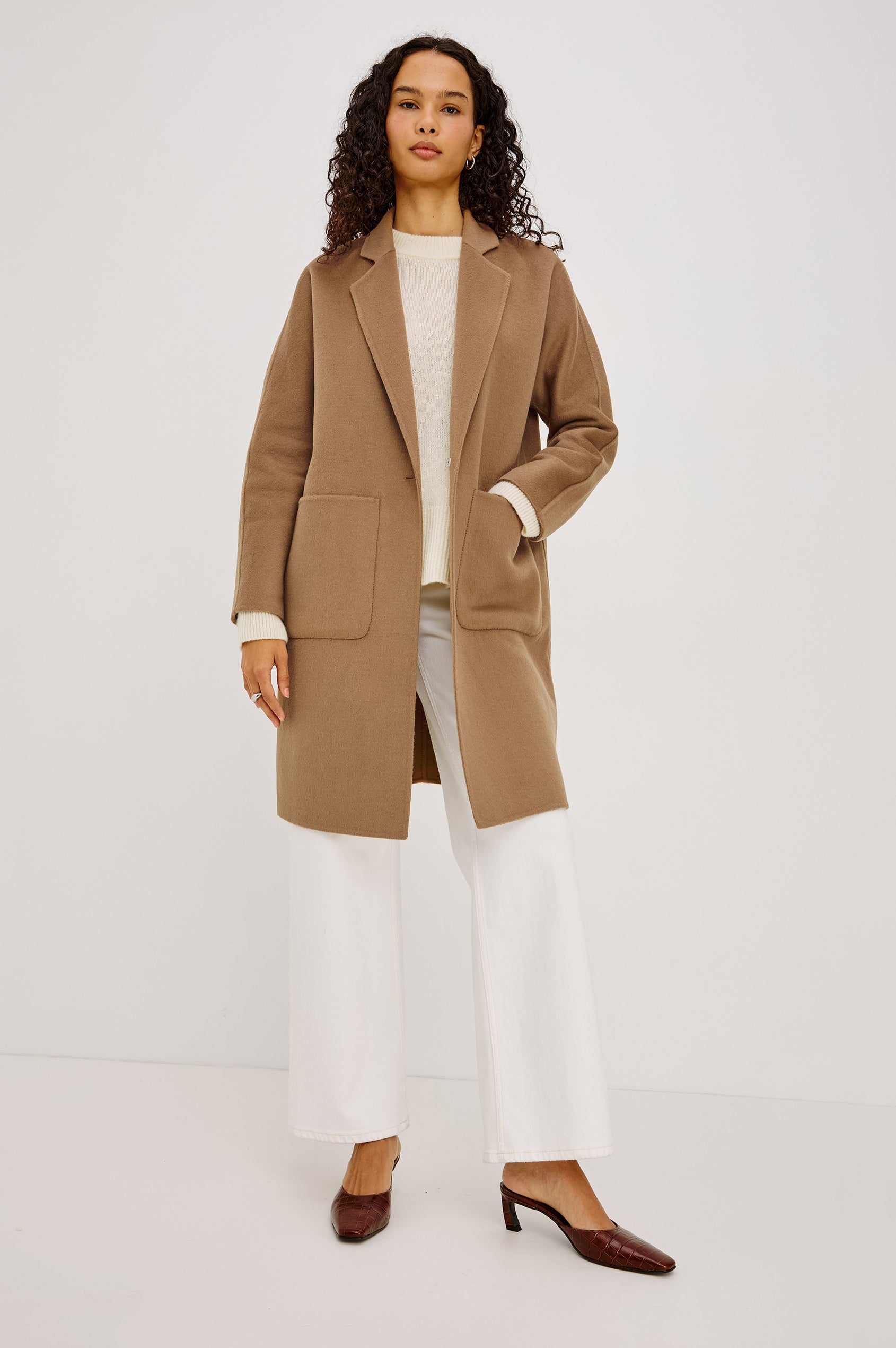 Everest Coat in Heavy Wool Blend With Longline Cut, Slightly Oversized Relaxed Fit, Lapel Collar, Single-Button Front, and Front Patch Pockets in Oat Camel Colorway - Full Body Front View Featured on Model