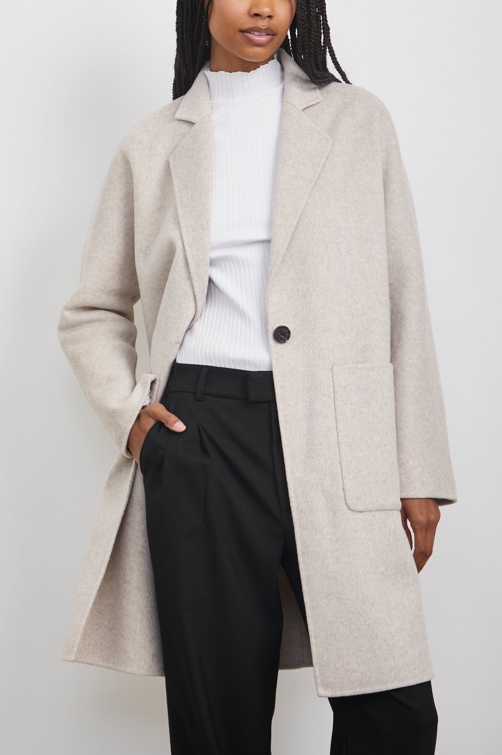 Everest Mid-Thigh Length Coat with Single Button Closure, Notched Lapels and Front Patch Pockets in Oatmeal Colorway - Front View Featured on Model