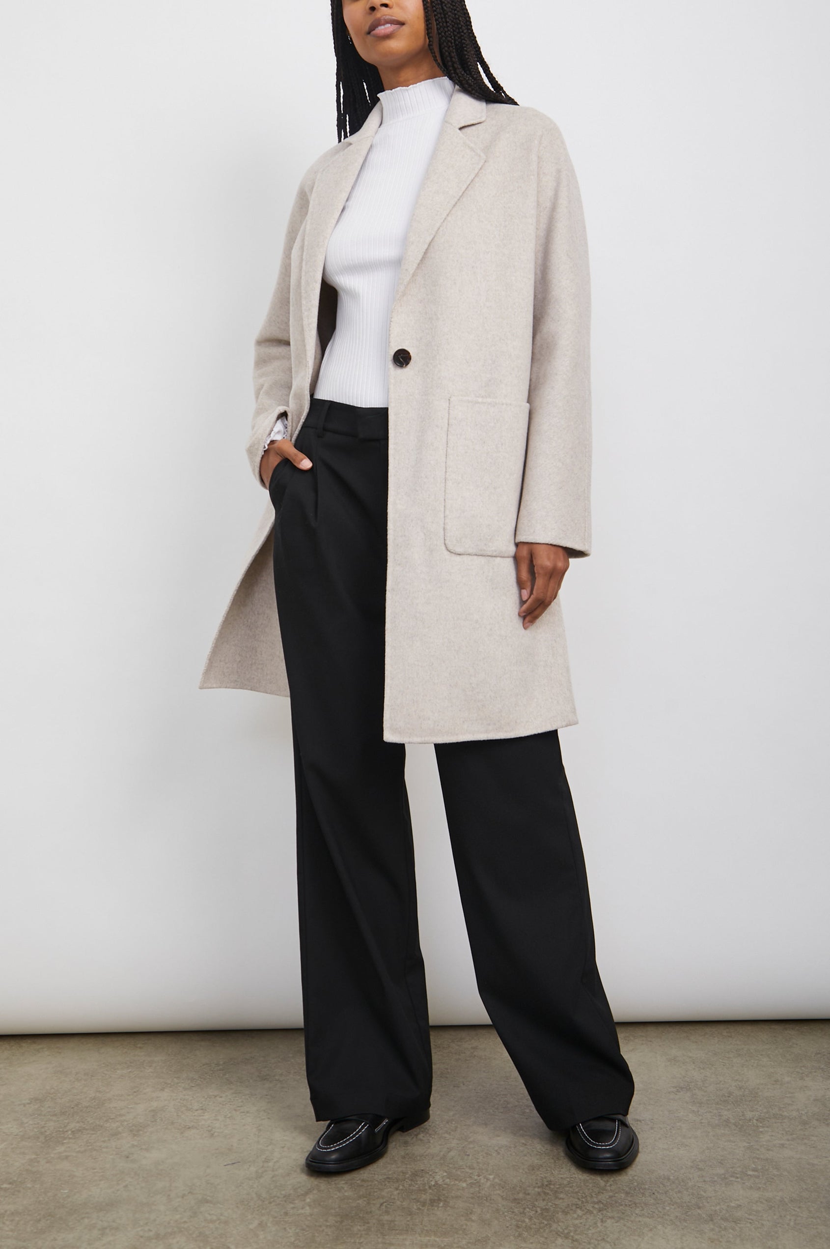 Everest Mid-Thigh Length Coat with Single Button Closure, Notched Lapels and Front Patch Pockets in Oatmeal Colorway - Front Full Body View Featured on Model