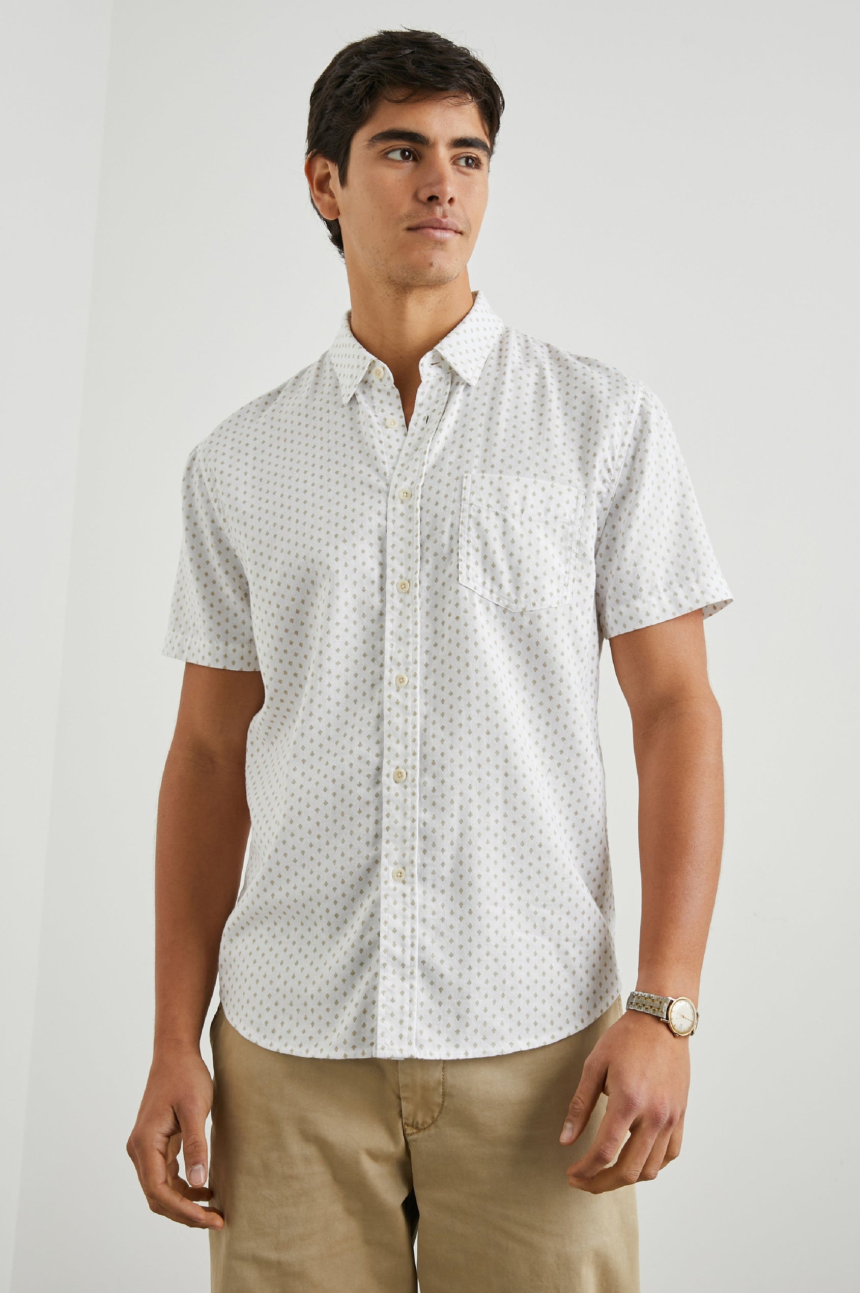 Fairfax Short-Sleeve Button Up with a Chest Patch Pocket in Polygon Micro White Colorway, with small polygons on White - Front View Featured on Model