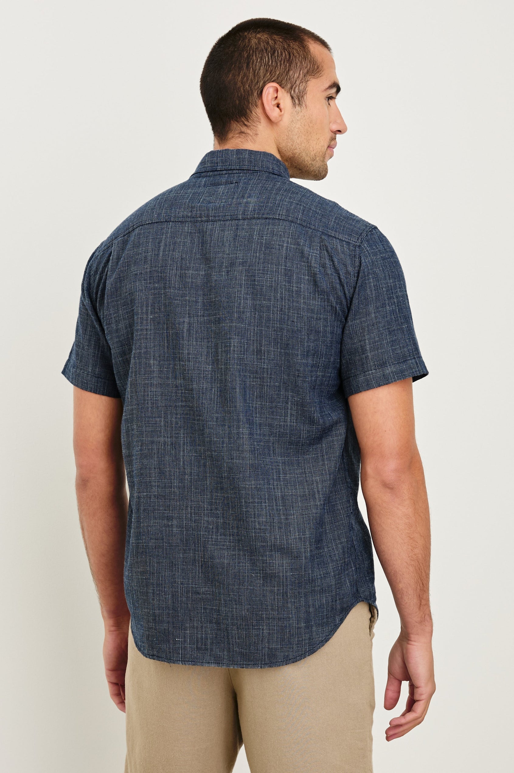 Fairfax short sleeve relaxed fit button up shirt with collar and chest pocket in Navy Etch - back view on model