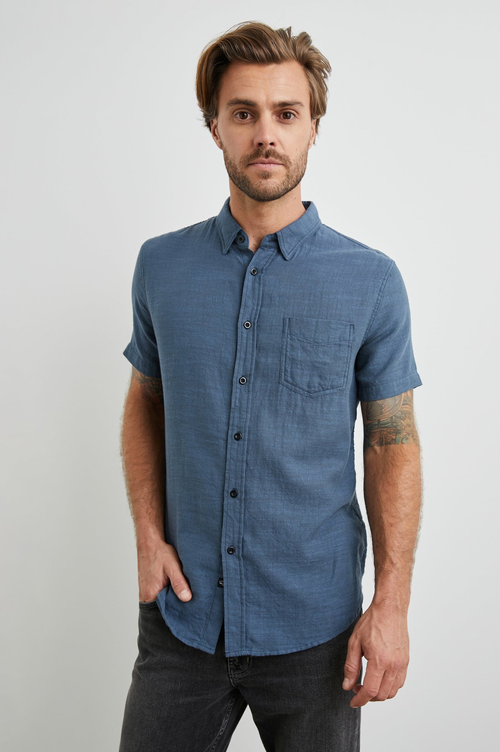 Fairfax Short-Sleeve Button Up with a Chest Patch Pocket in Sea Blue Colorway - Front View Featured on Model