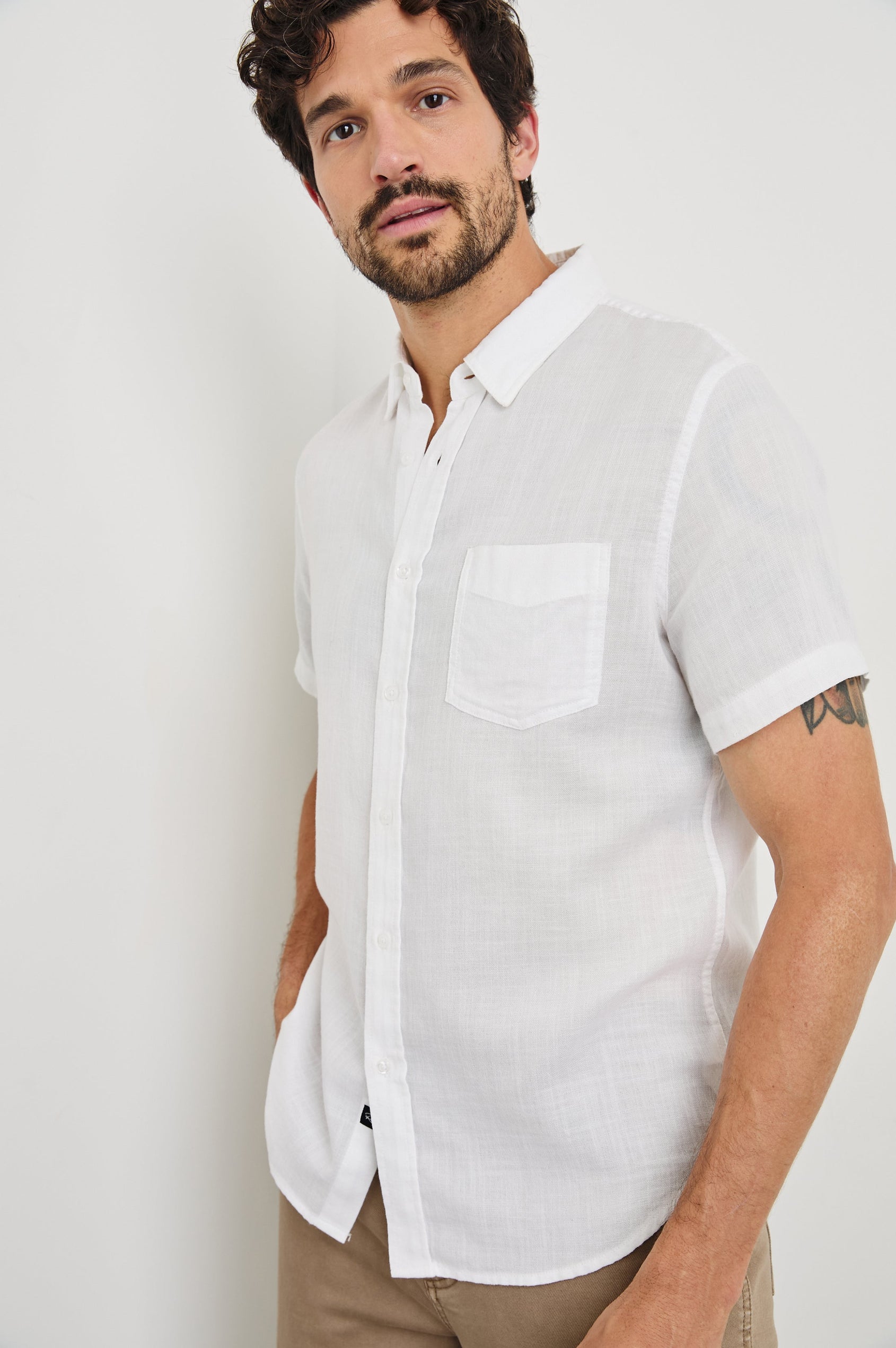 Fairfax short sleeve button up shirt with collar and chest pocket in White - front view on model, slight angle