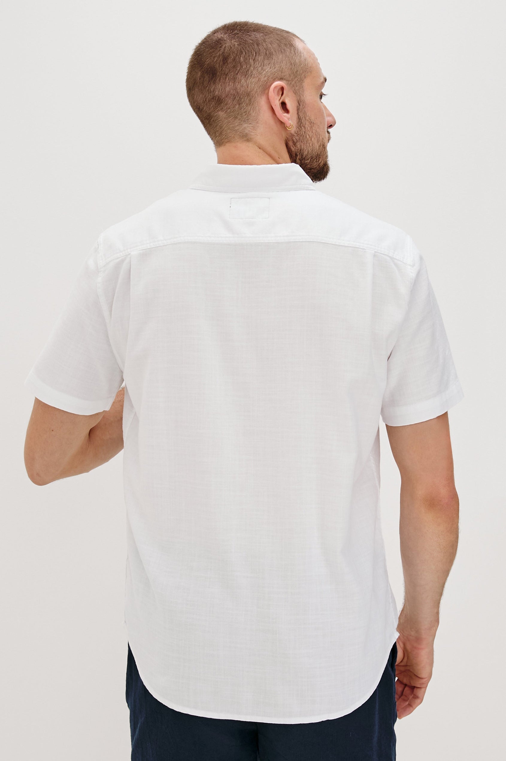 Fairfax short sleeve button up shirt with collar and chest pocket in White - back view on model