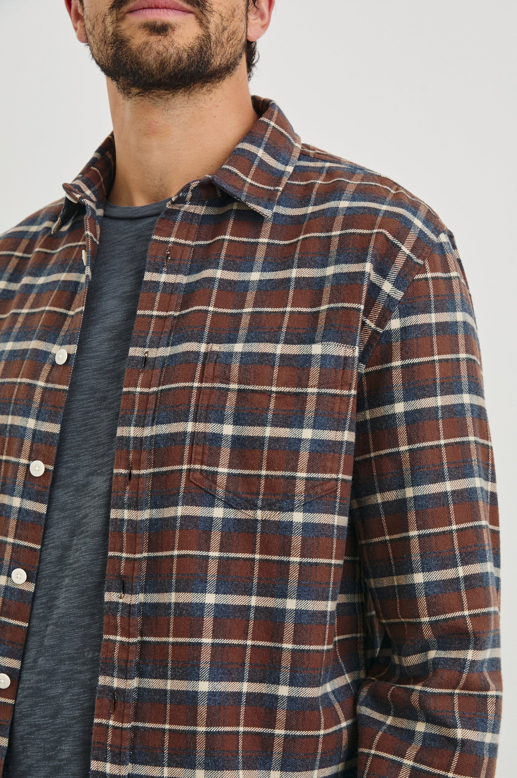 Forrest Long-Sleeve Button Up with a Chest Patch Pocket in Hickory Blue Melange Colorway, a Brown, Blue and White plaid - Front View Featured on Model