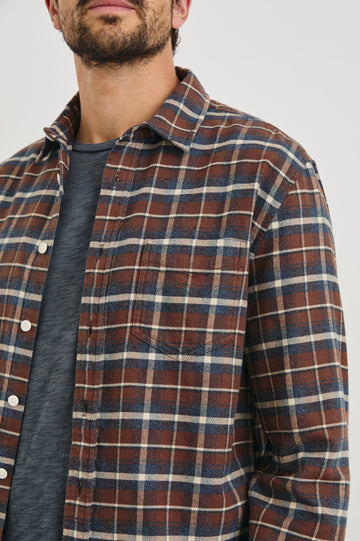 Forrest Long-Sleeve Button Up with a Chest Patch Pocket in Hickory Blue Melange Colorway, a Brown, Blue and White plaid - Front View Featured on Model