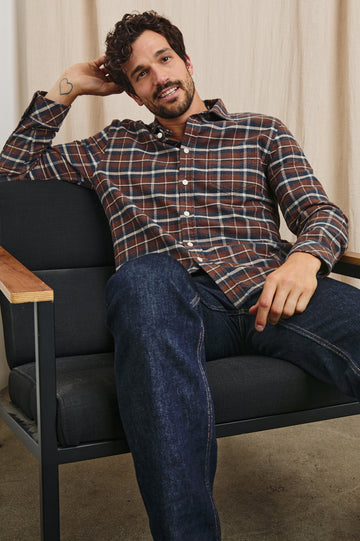 Forrest Long-Sleeve Button Up with a Chest Patch Pocket in Hickory Blue Melange Colorway, a Brown, Blue and White plaid - Front Full Body View Featured on Seated Model