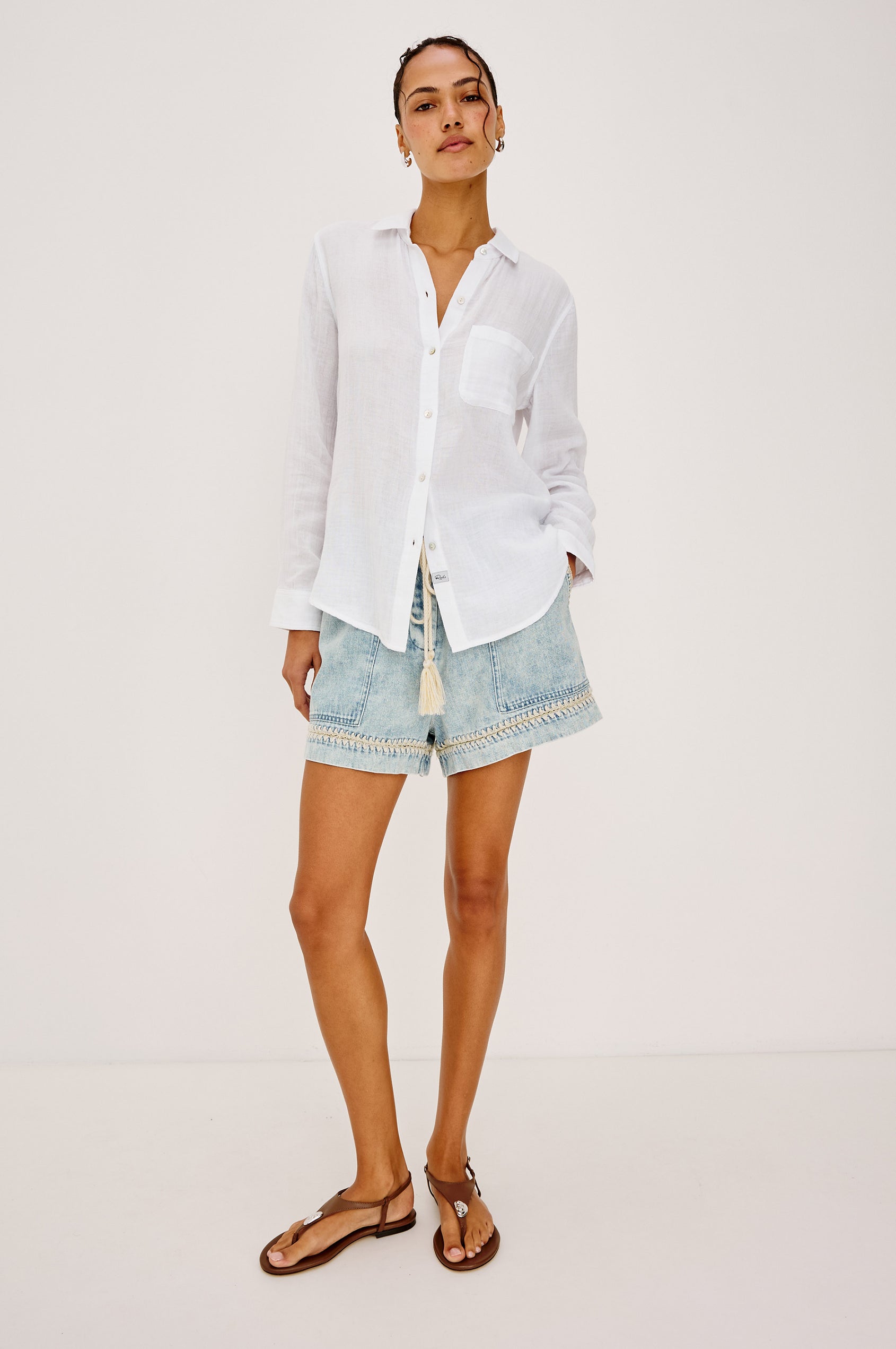 Foster Short in TENCEL™ Denim With High Drawstring Paperbag Waist With Adjustable Ties, Relaxed FIt, and Side and Back Pockets in Bleach Indigo Blanket Stitch Colorway - Full Body Front View Featured on Model