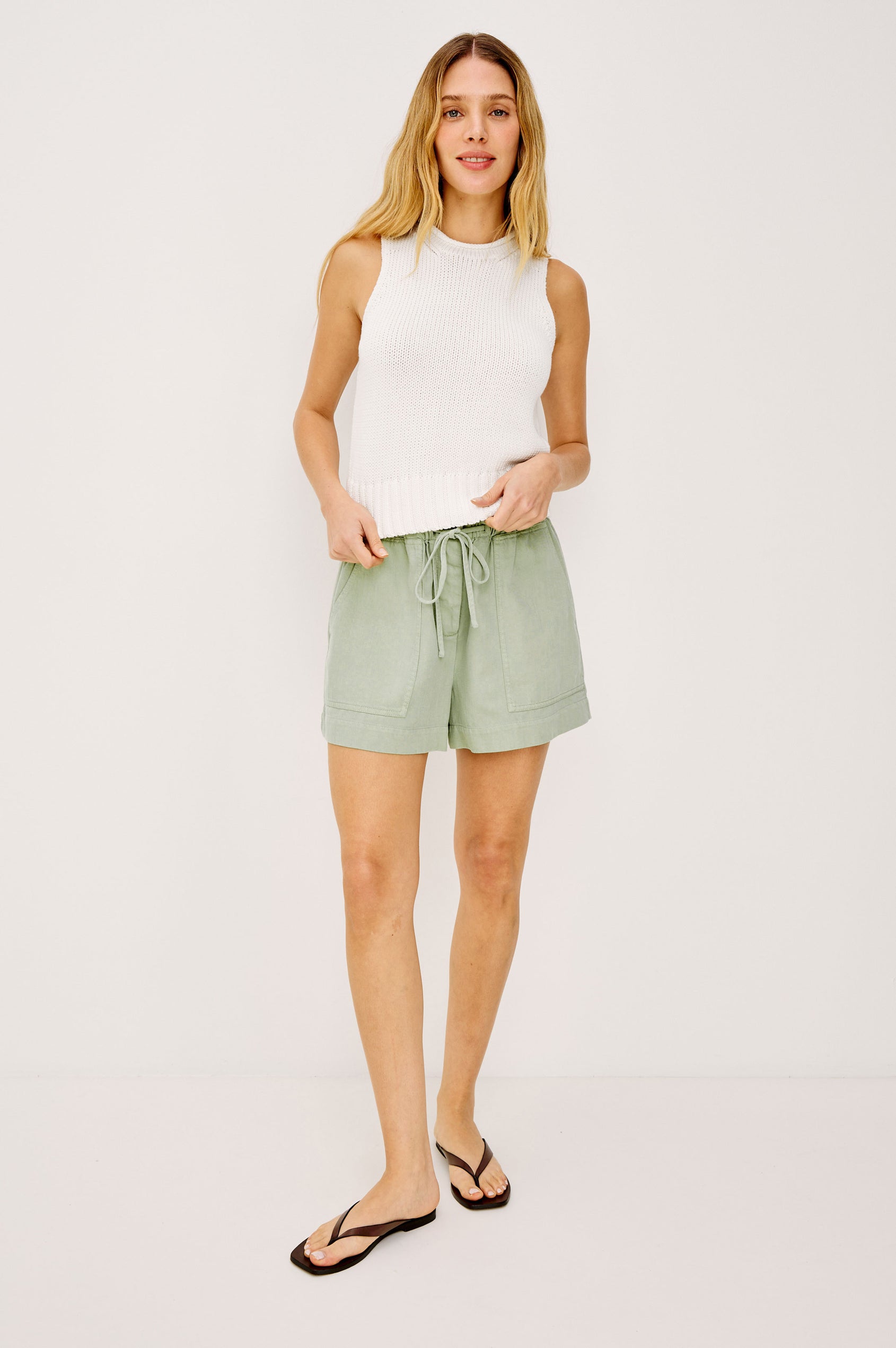 Foster Short in TENCEL™ Denim With High Drawstring Paperbag Waist With Adjustable Ties, Relaxed FIt, and Side and Back Pockets Vintage Sage Colorway - Full Body Front View Featured on Model