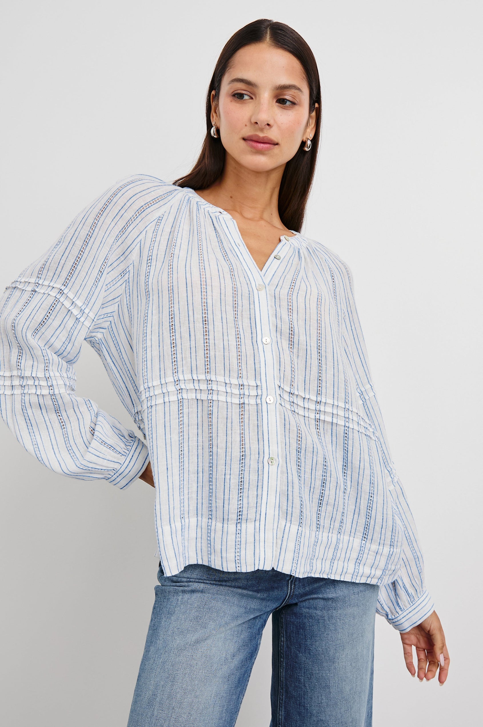 Frances Long-Sleeve Top with Buttons Down the Front, Button Cuffs, and Pleating Around the Neckline in Sonoma Stripe Colorway, Thin Blue Vertical Stripes on White - Front View Featured on Model