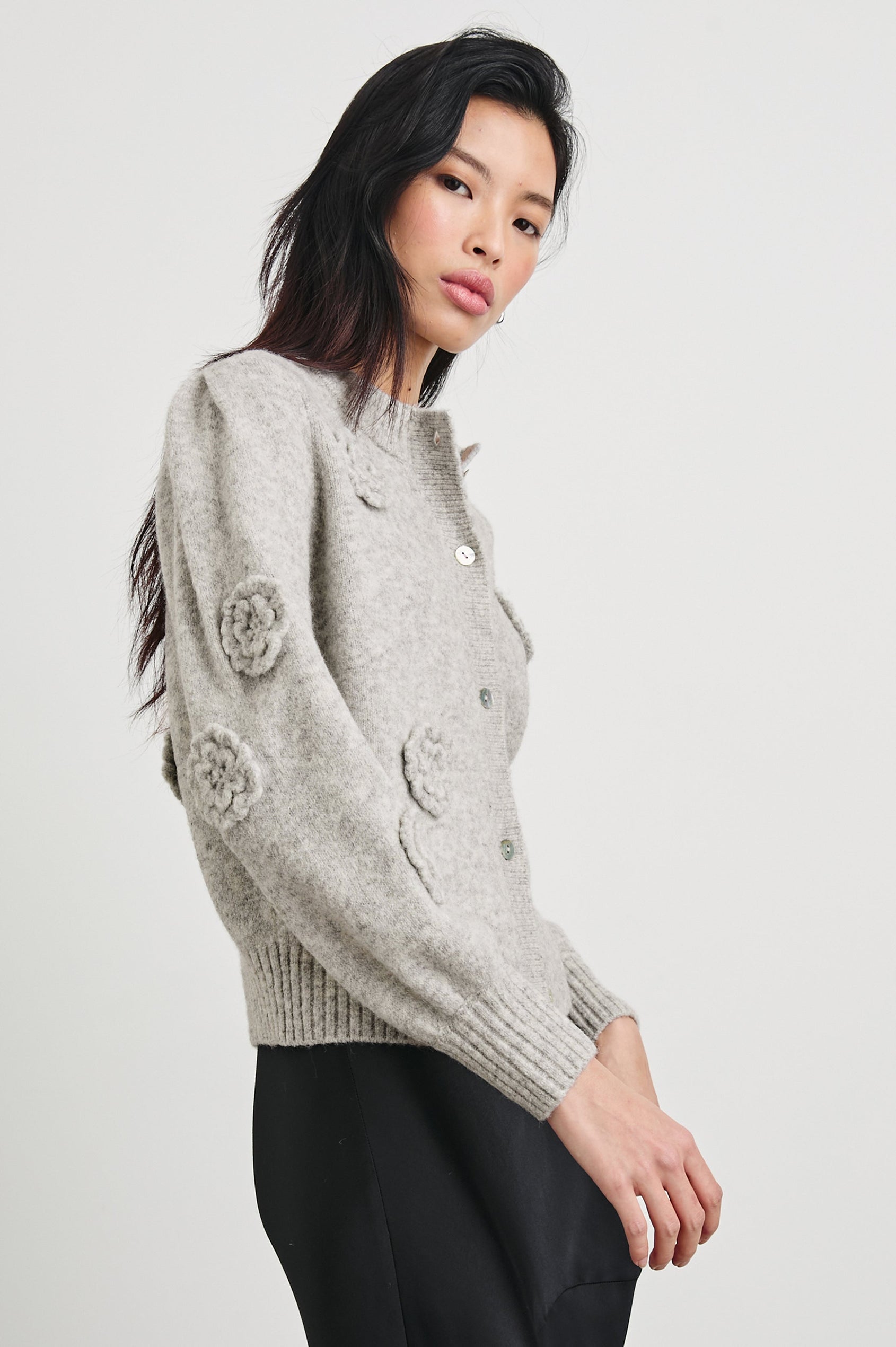 Francesca Long-Sleeve Cardigan with a Button Closure, Crew Neck, Ribbed Trim and Flower Appliques in Heather Grey Colorway - Side View Featured on Model