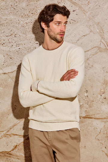 The Franco is a long sleeve crew neck sweater with contrast brown on neck, sleeve and hem in Cream colorway. Front view featured on model.